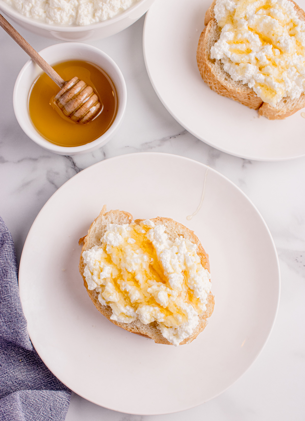 Fresh ricotta on toasted bread with honey drizzle