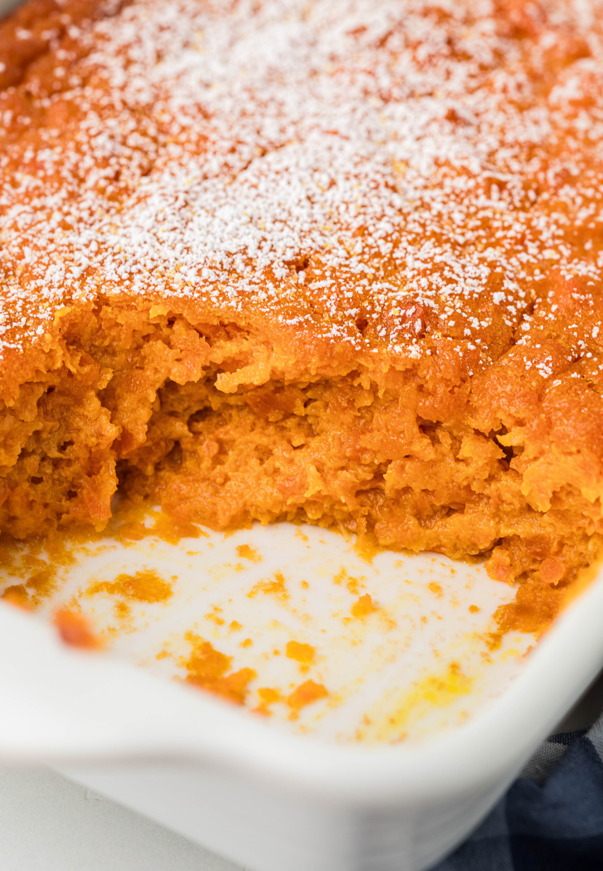 Carrot Souffle showing fluffy interior and lightly browned top in baking dish