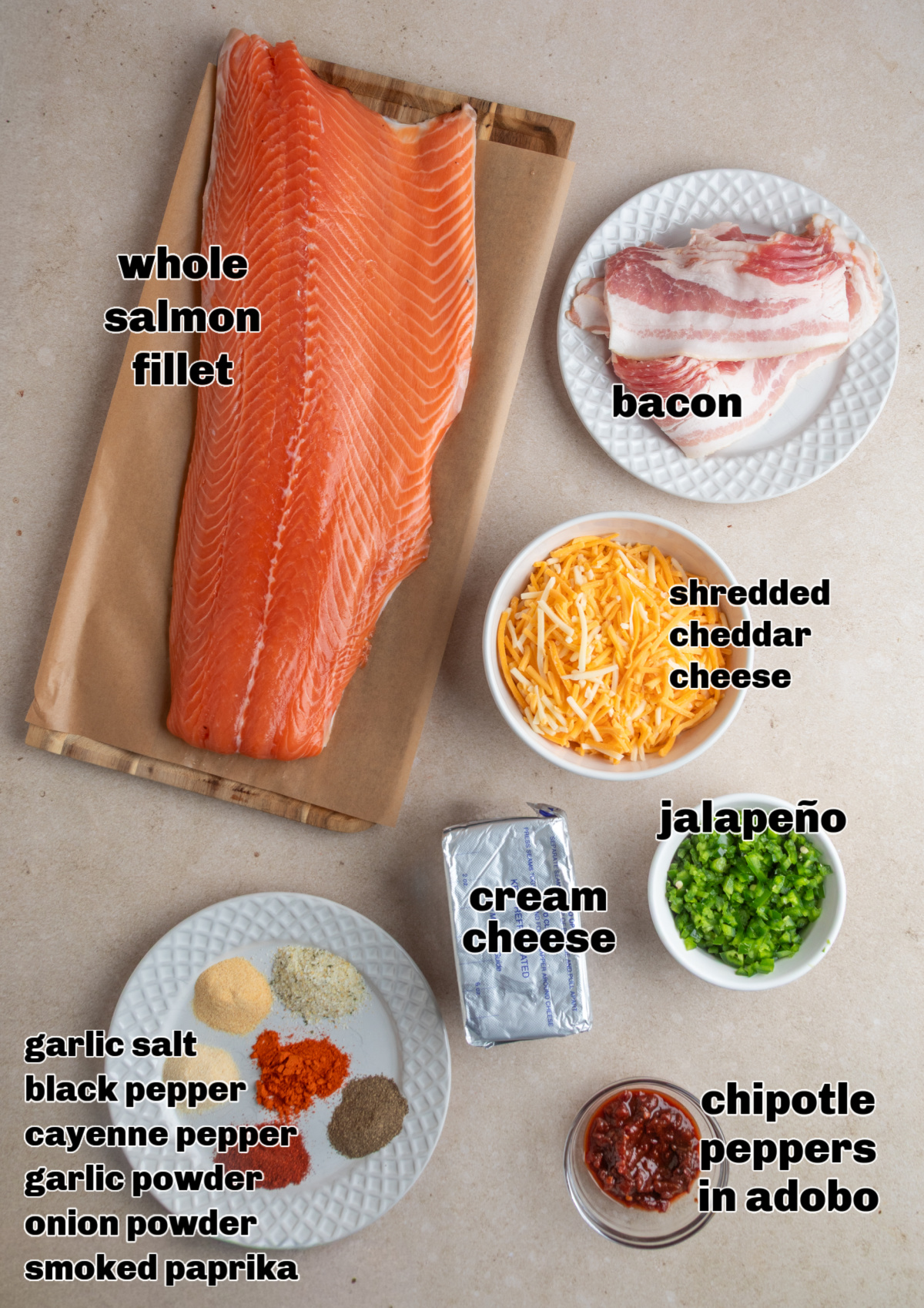 Ingredients for chipotle jalape&ntilde;o popper stuffed salmon rolls arranged on a work surface