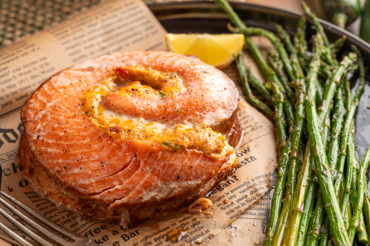Baked stuffed salmon pinwheel with creamy jalape&ntilde;o popper filling and roasted asparagus