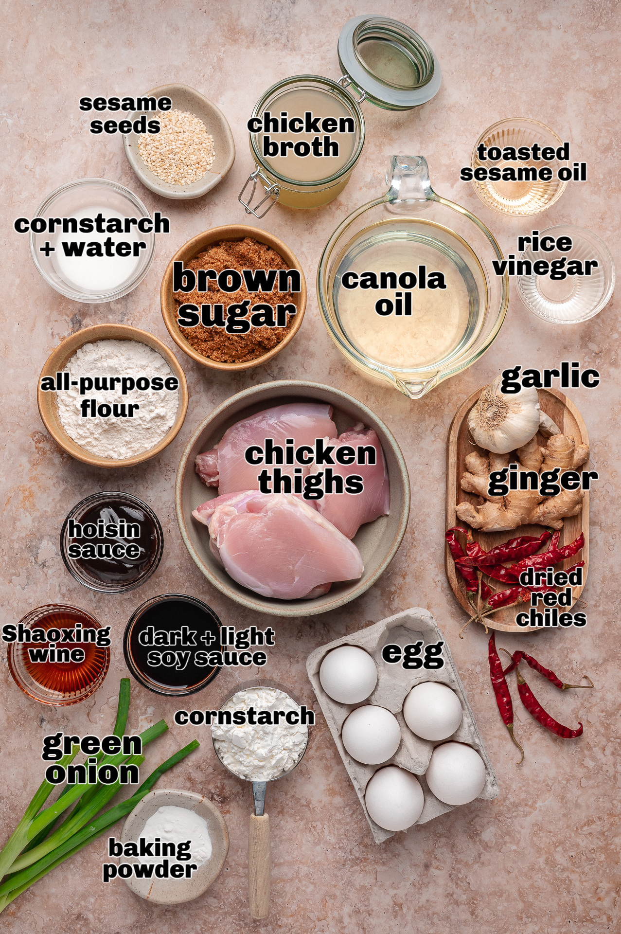 Ingredients for General Tso&rsquo;s chicken including chicken thighs, soy sauce, brown sugar, garlic, ginger, and dried red chilies