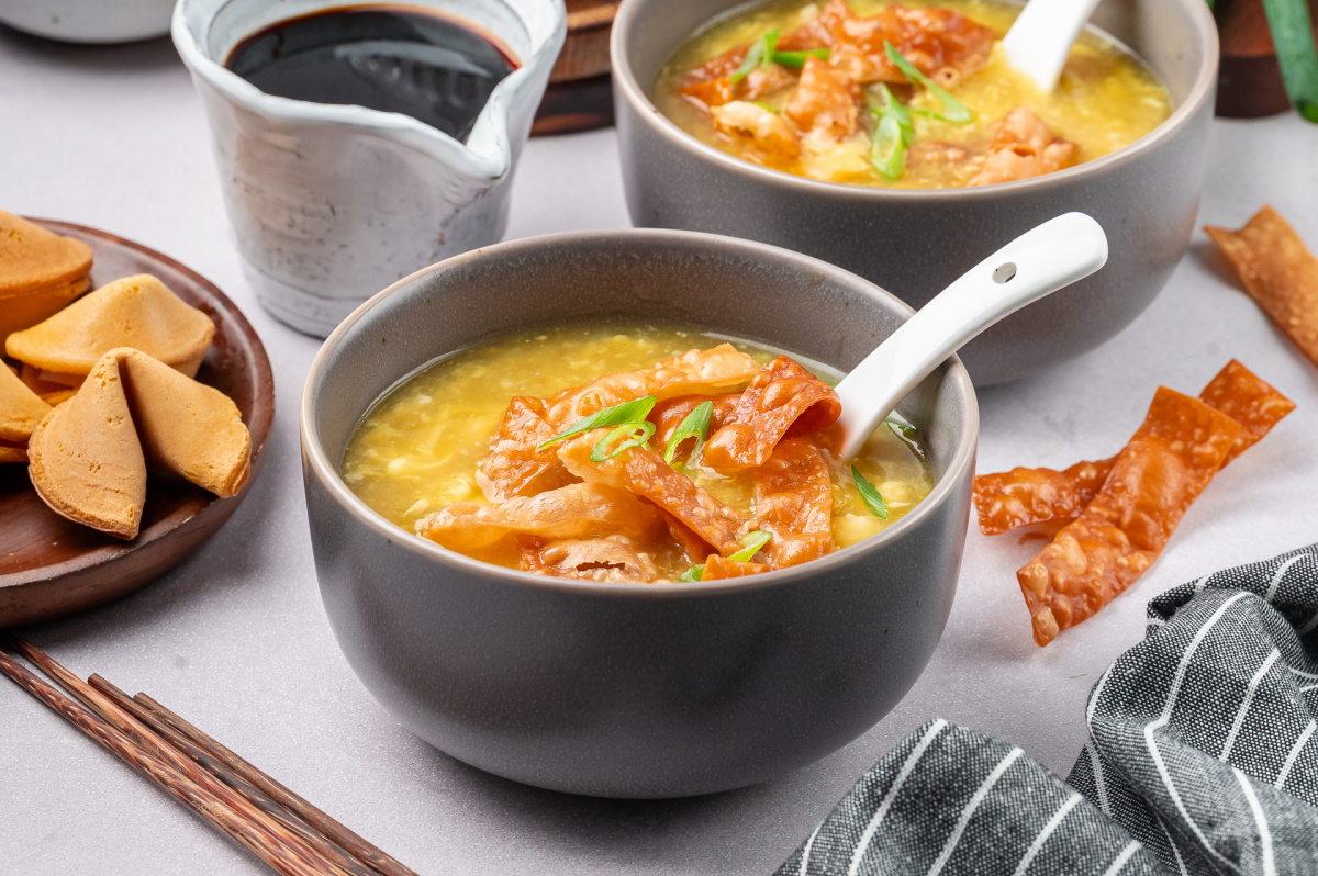 Egg drop soup with fried wonton strips served in bowls