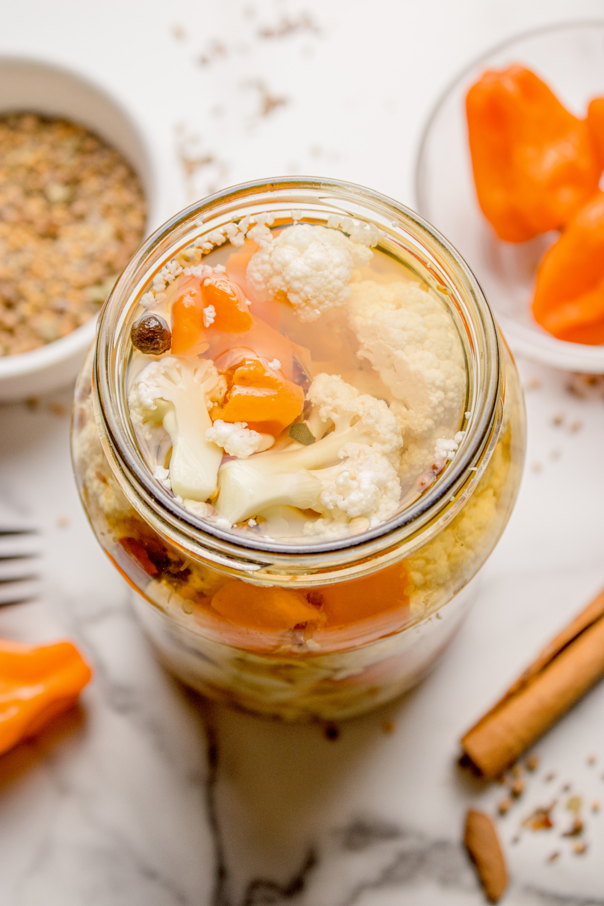 Homemade spicy cauliflower refrigerator pickles with habanero peppers and whole spices