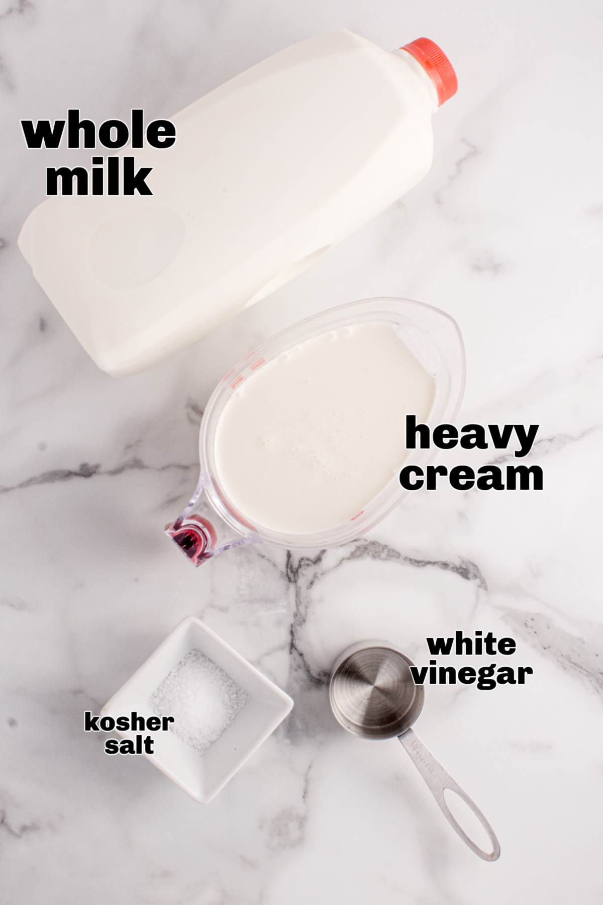 Ingredients for homemade ricotta cheese including milk, cream, vinegar, and salt