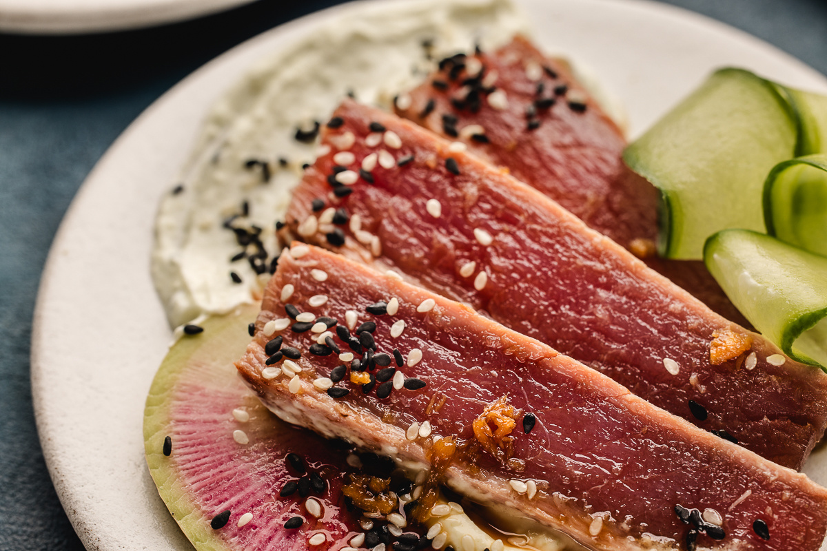 Rare ahi tuna with wasabi Greek yogurt smear, sesame seeds, and watermelon radish