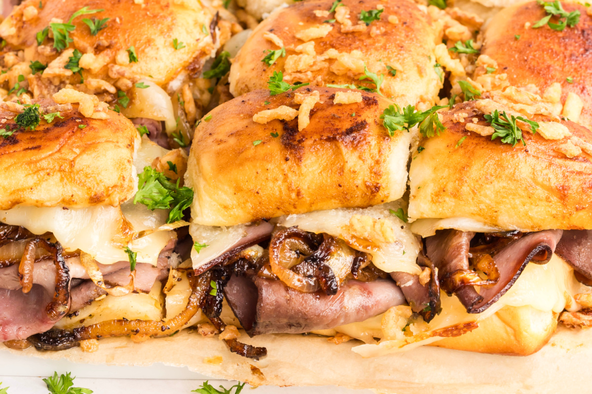French dip sliders with roast beef, melted provolone, caramelized onions, and French-fried onions