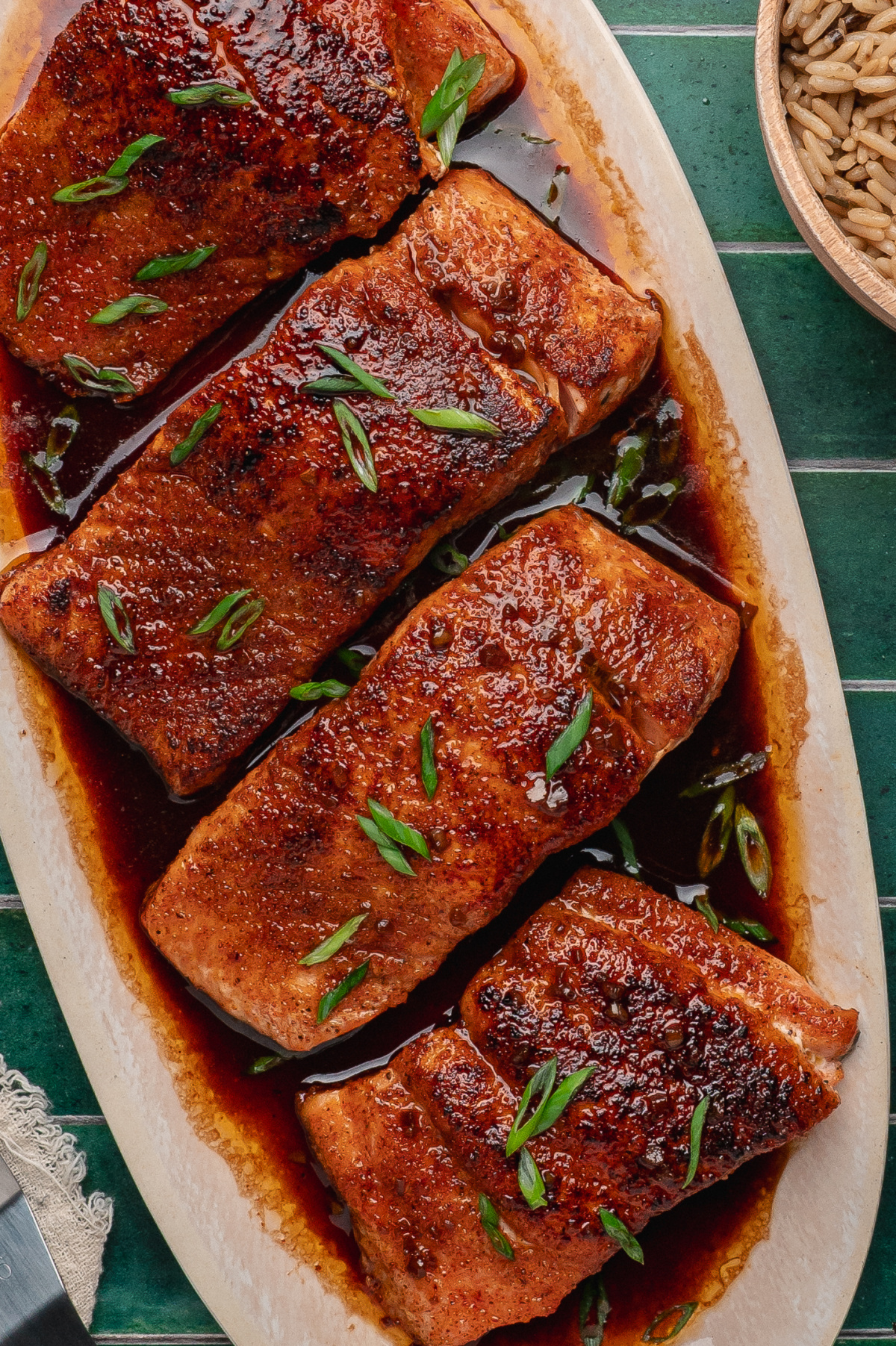 bourbon glazed salmon with crispy seared edges and a glossy brown sugar bourbon glaze