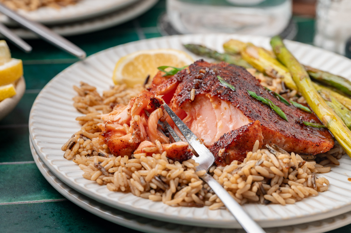 bourbon glazed salmon with a flaky center showing tender pan seared texture and glossy glaze