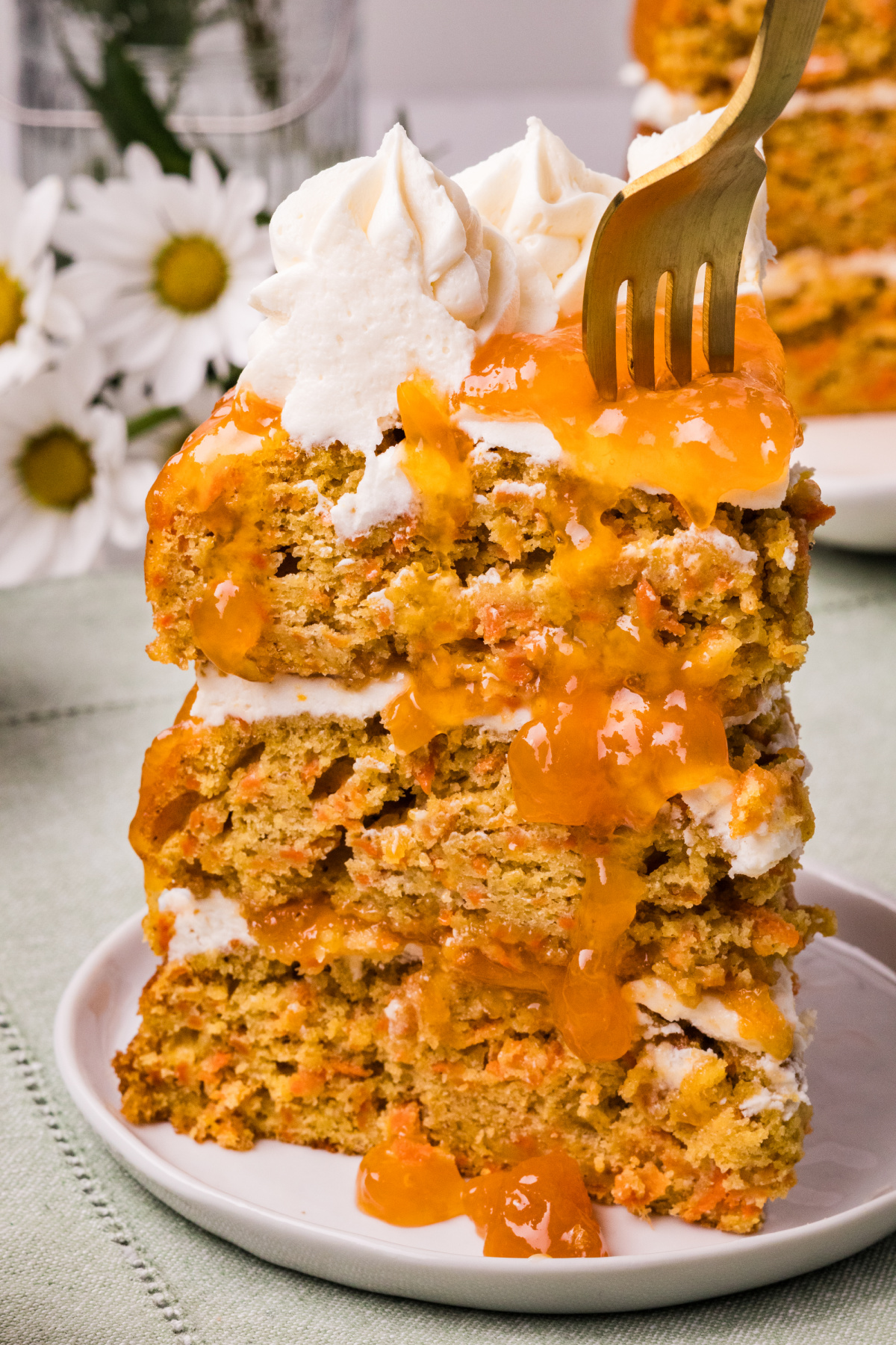 sliced carrot cake with a fork