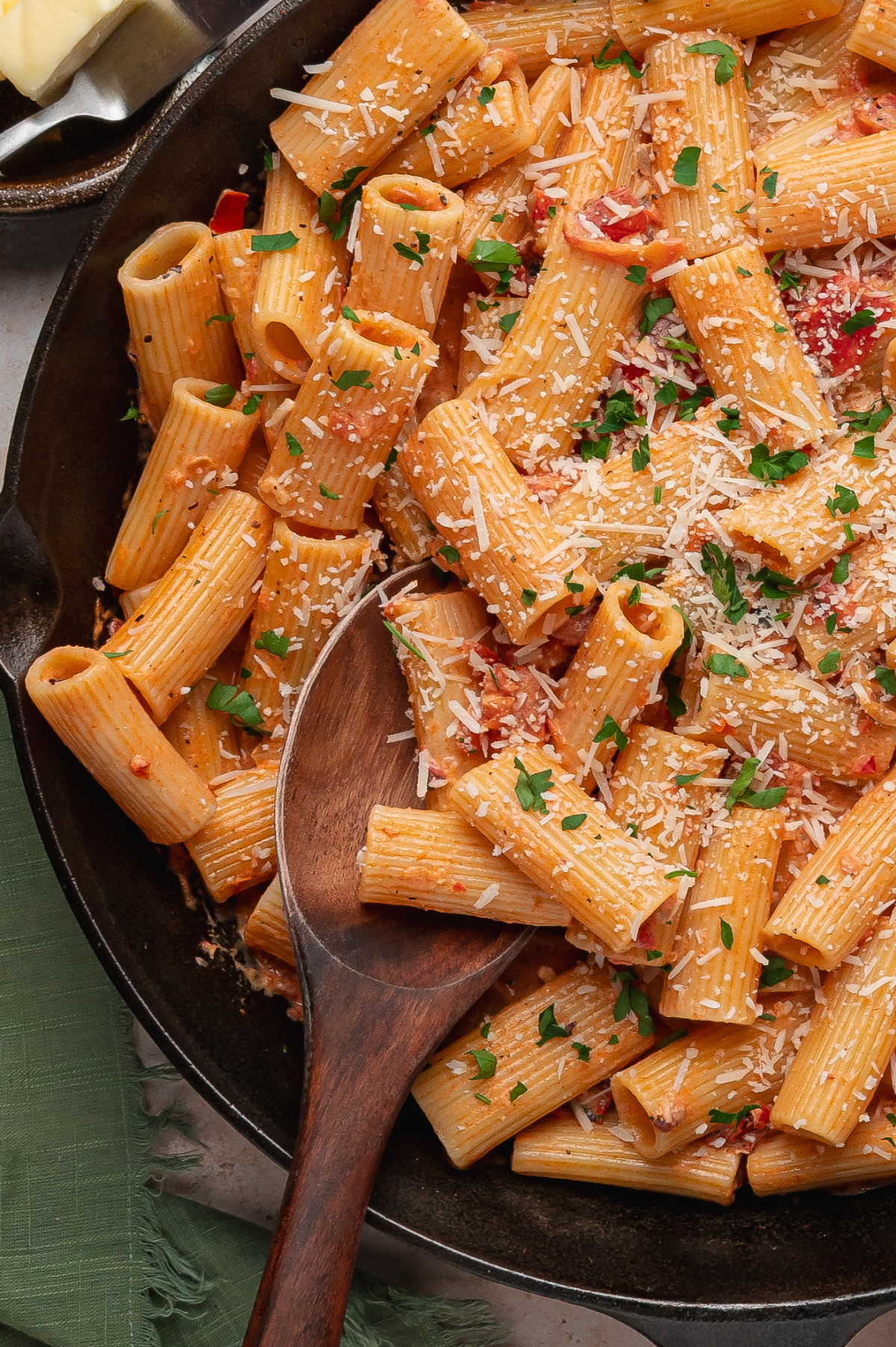 Rigatoni pasta in creamy Calabrian chili tomato sauce with Parmesan and parsley in a skillet