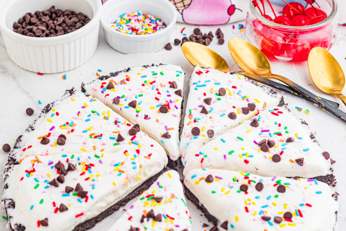 easy ice cream pizza with Oreo crust topped with sprinkles and chocolate chips