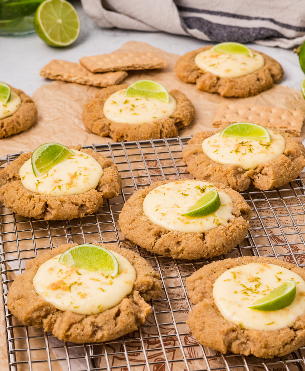 key lime pie cookies with graham cracker base, creamy lime filling, and fresh lime wedges