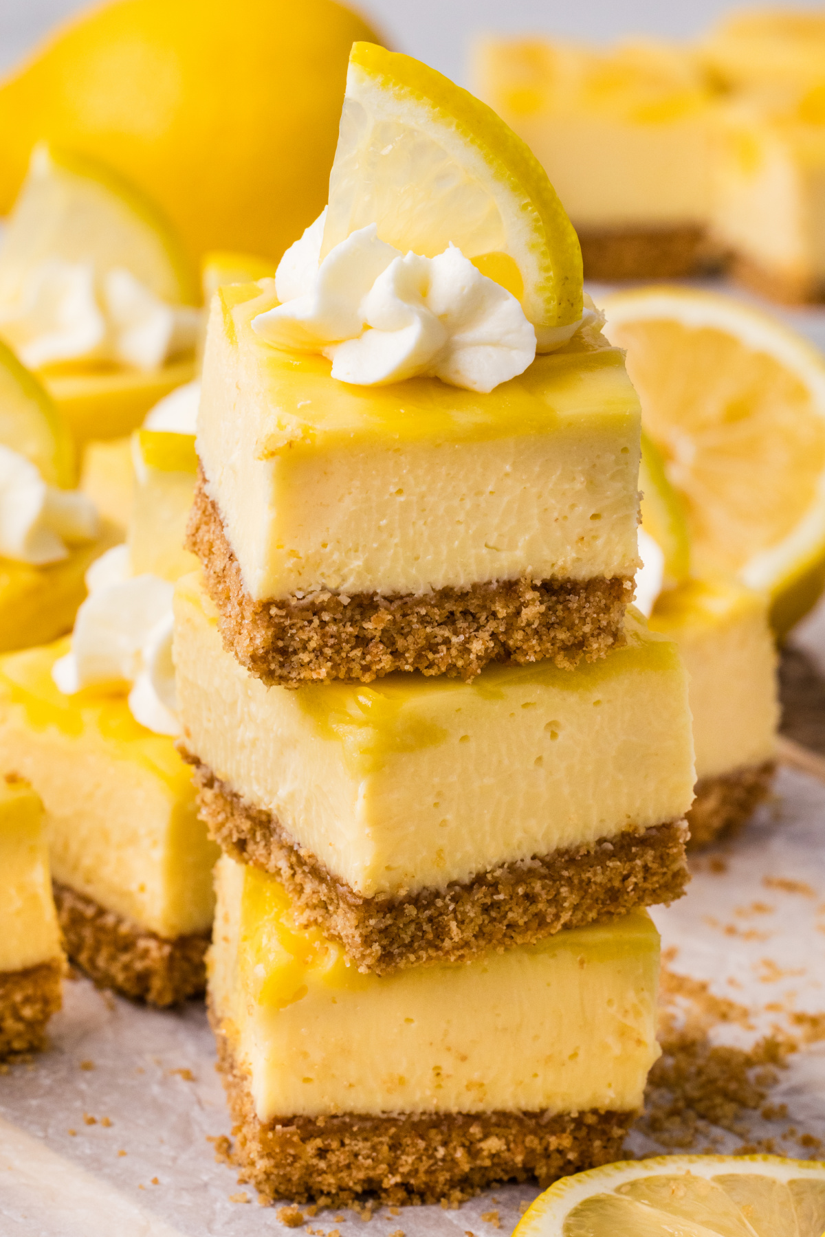 lemon cheesecake bars with graham cracker crust and lemon curd topping