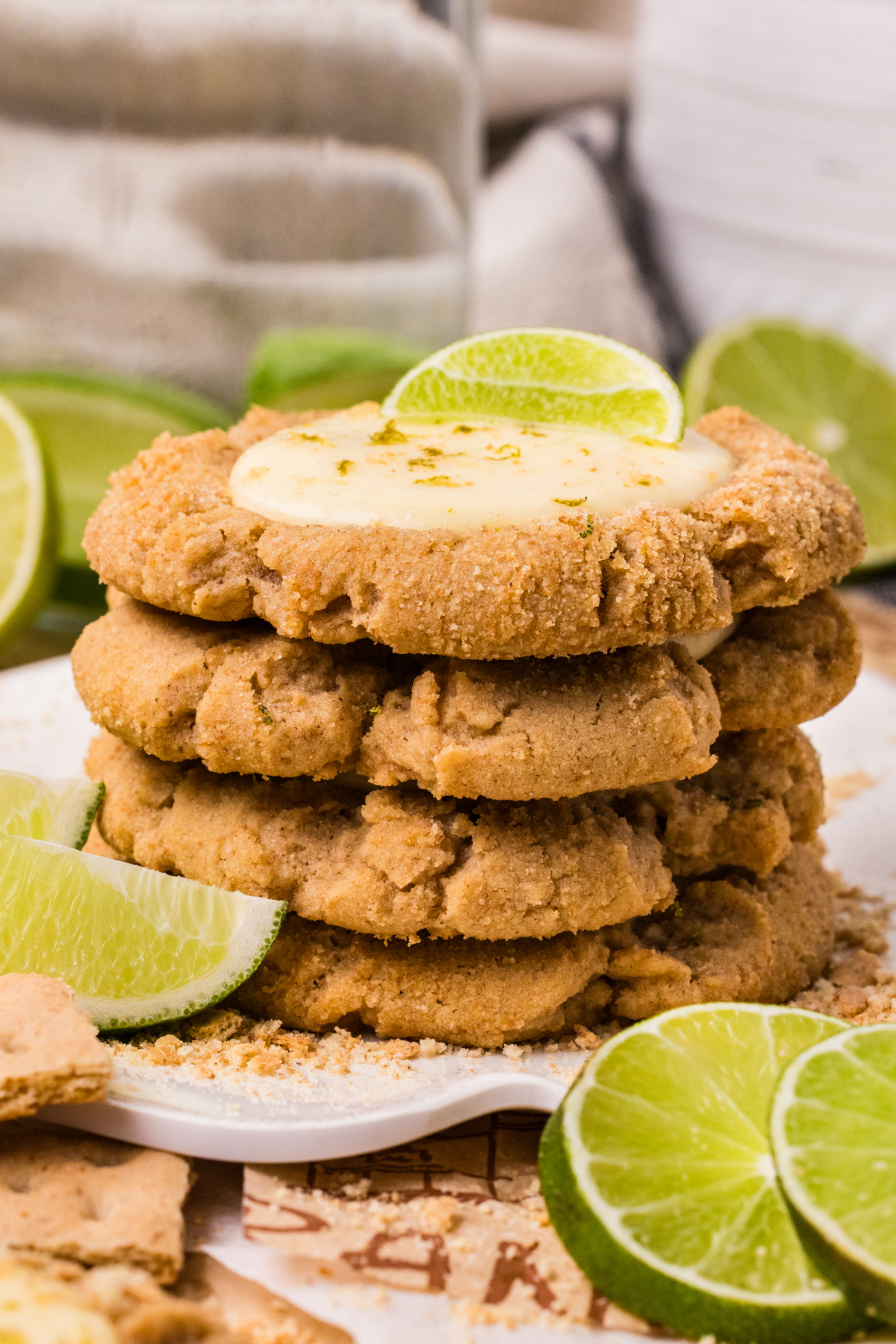 stacked graham cracker cookies with creamy lime filling and fresh lime slices