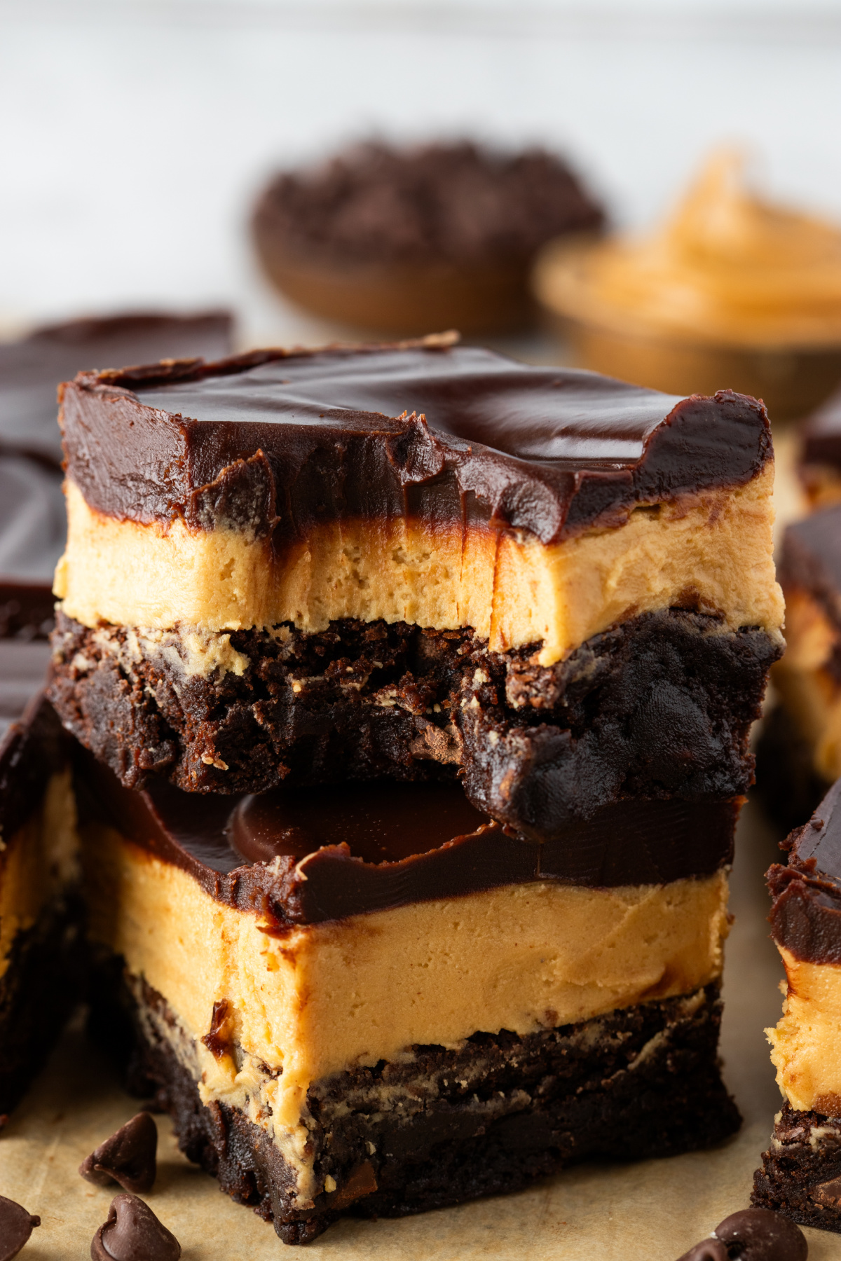 Cold Buckeye brownies with thick peanut butter filling and fudgy chocolate brownie base