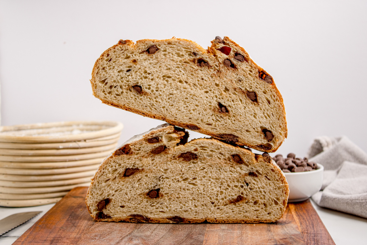 Chocolate Chip Artisan Bread cut in half showing the interior crumb with chocolate chips throughout