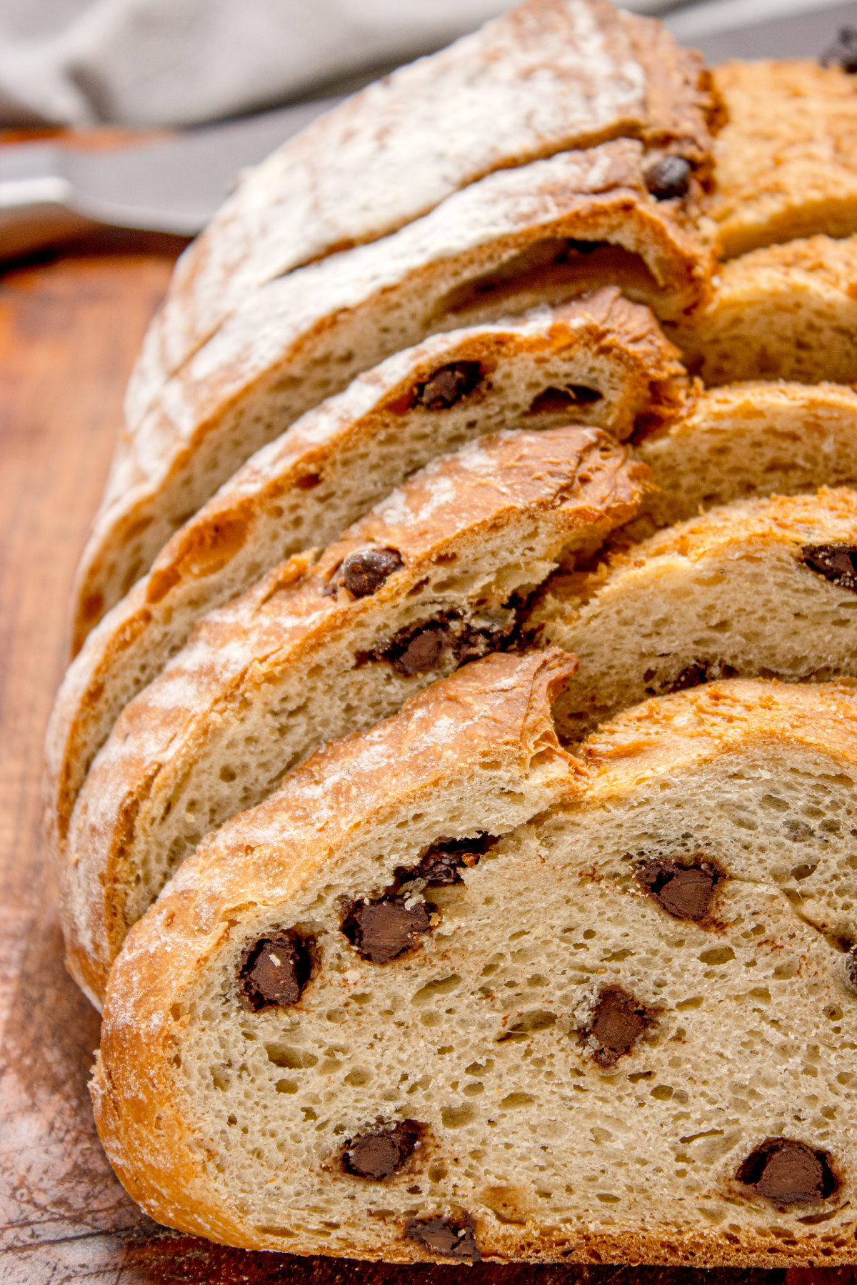 close-up of sliced chocolate chip bread showing airy crumb and chocolate pieces inside