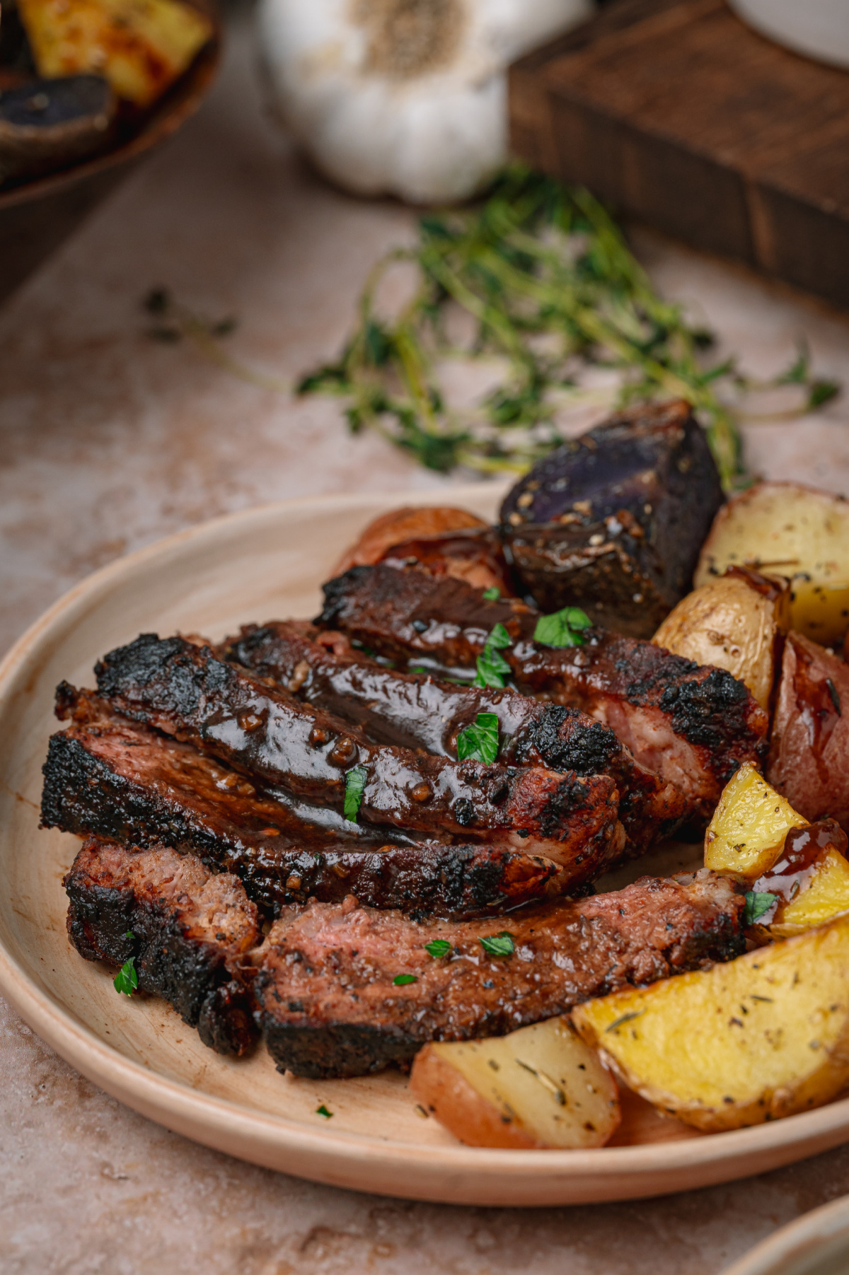 cocoa rubbed steak coated in dark stout pan sauce over roasted potatoes.