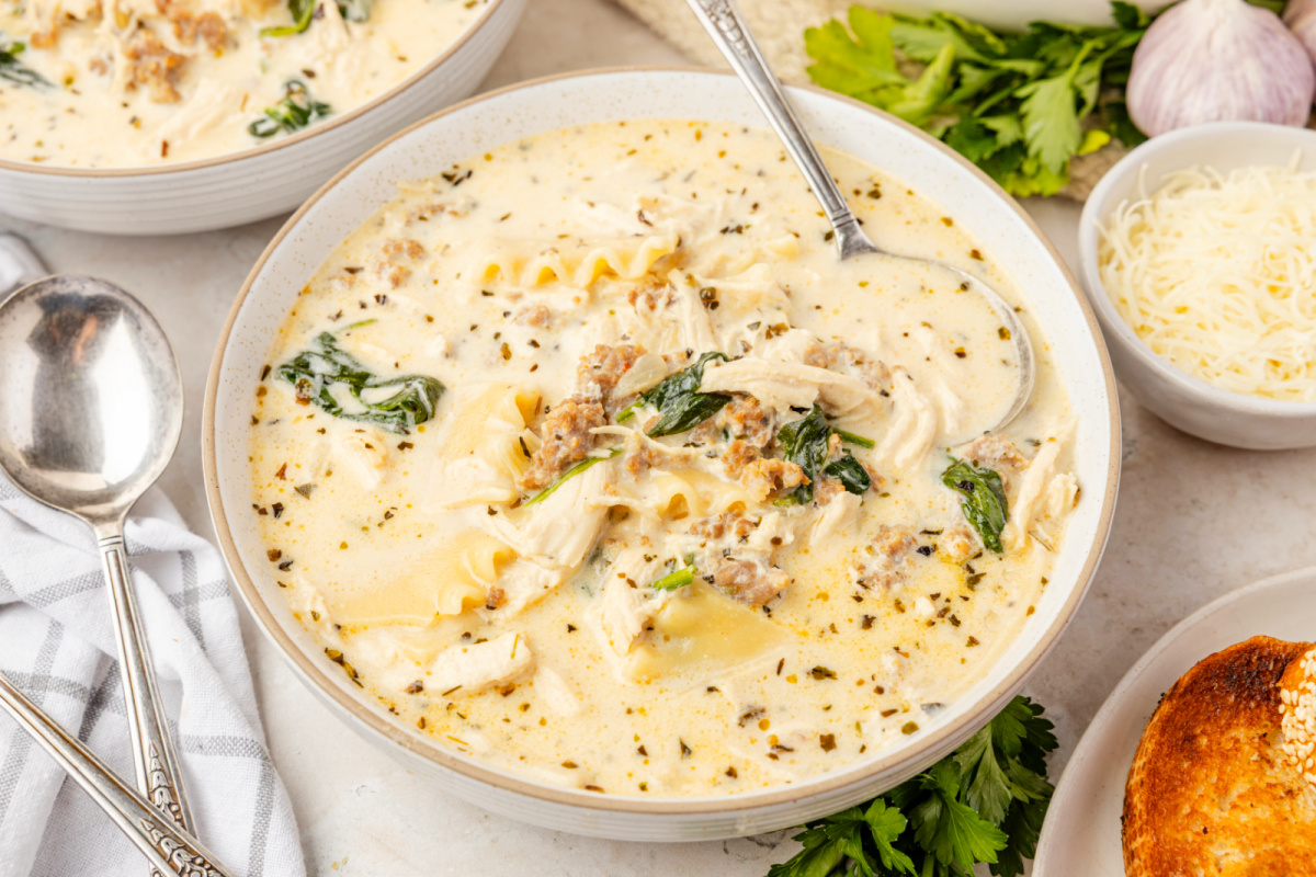 Creamy White Lasagna Soup with chicken, sausage, ricotta, and lasagna noodles Creamy White Lasagna Soup with chicken, sausage, spinach, and broken lasagna noodles in a creamy ricotta broth