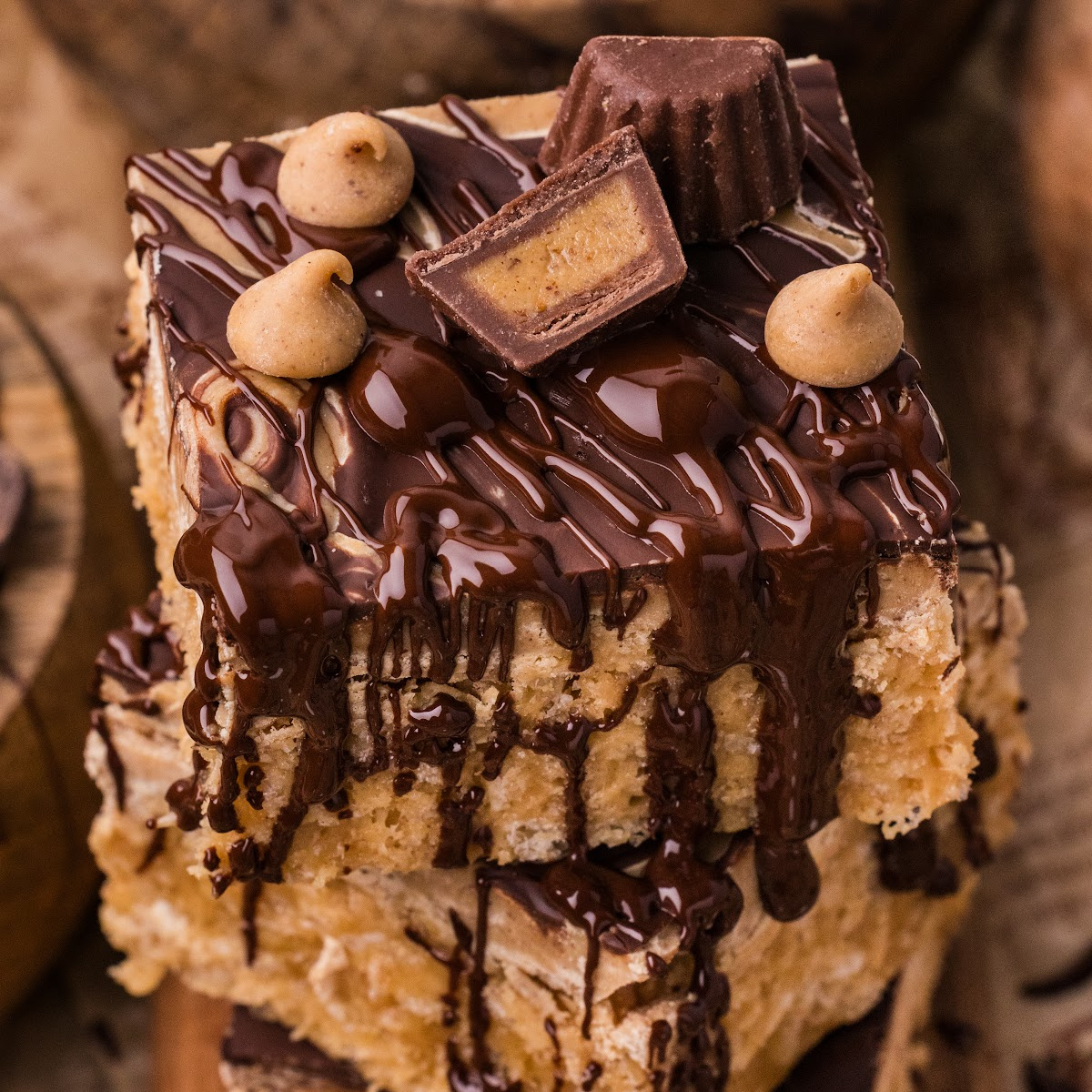 Bakery-style marbled peanut butter crunch bars stacked with chocolate drizzle and peanut butter cups