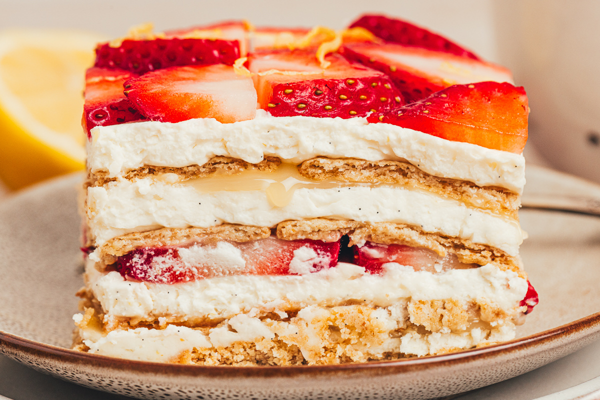 No-Bake Strawberry Lemon Icebox Cake with mascarpone cream, lemon curd, strawberries, and softened graham cracker layers.