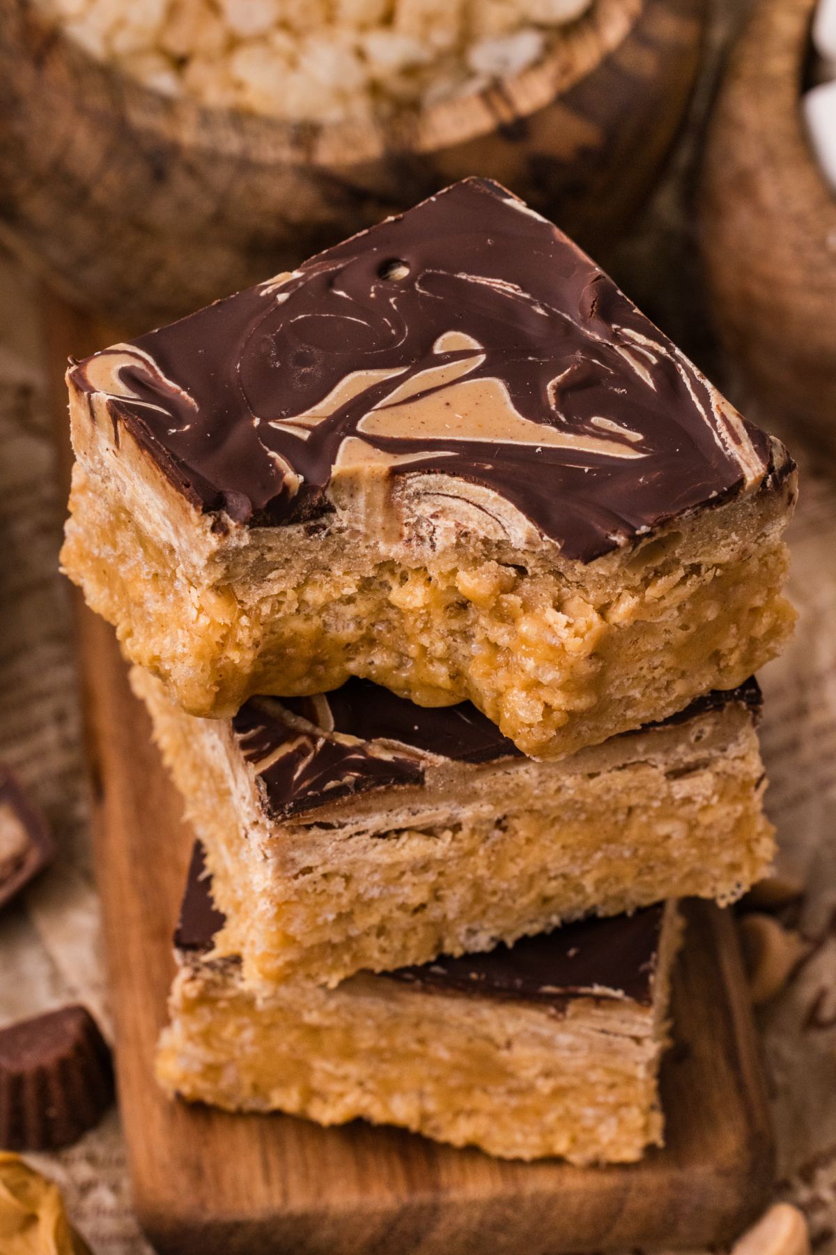 Soft peanut butter crunch bars stacked with marbled chocolate topping and chewy marshmallow cereal center