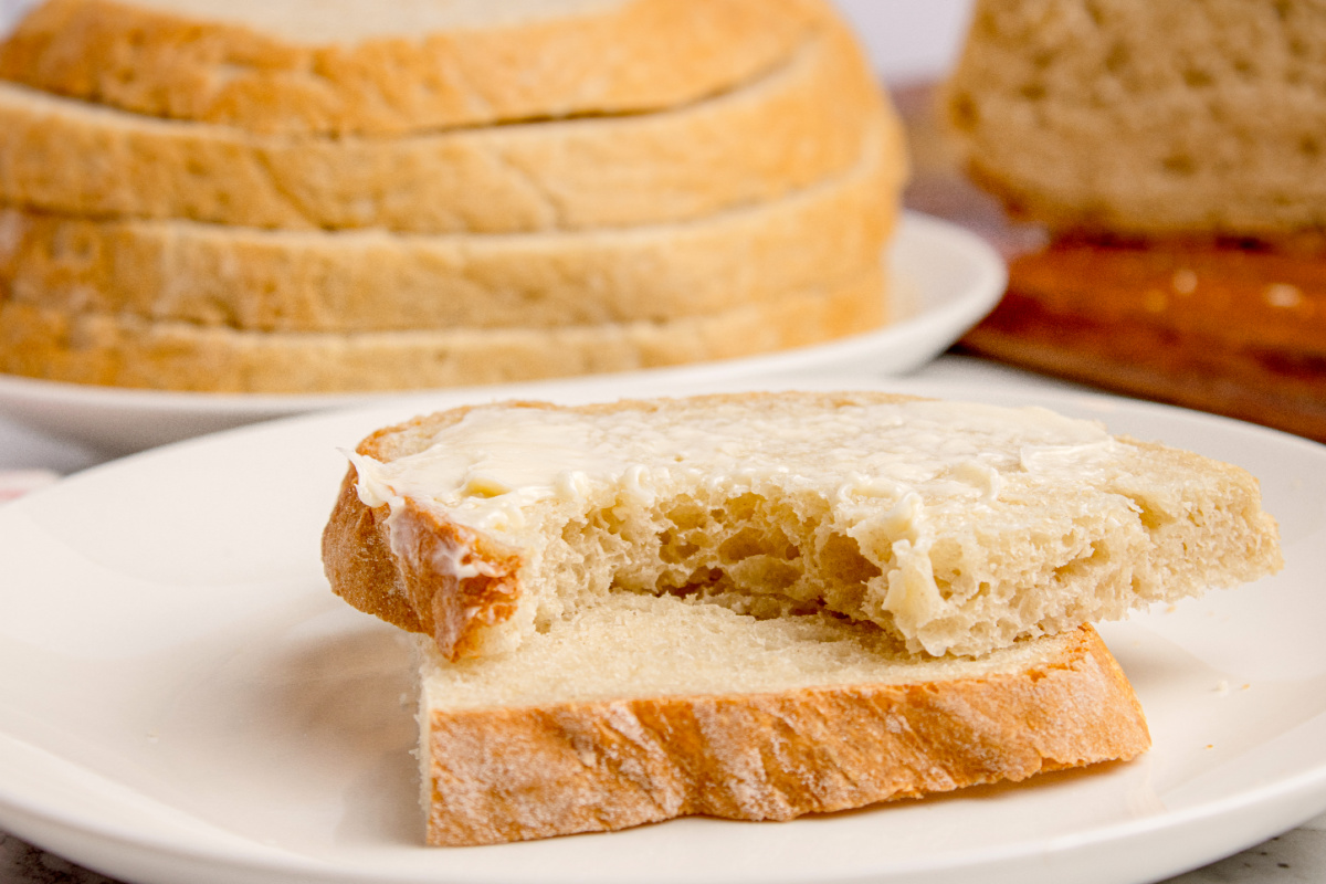Buttered Peasant Bread Slice Slice of peasant bread with butter showing the soft interior texture