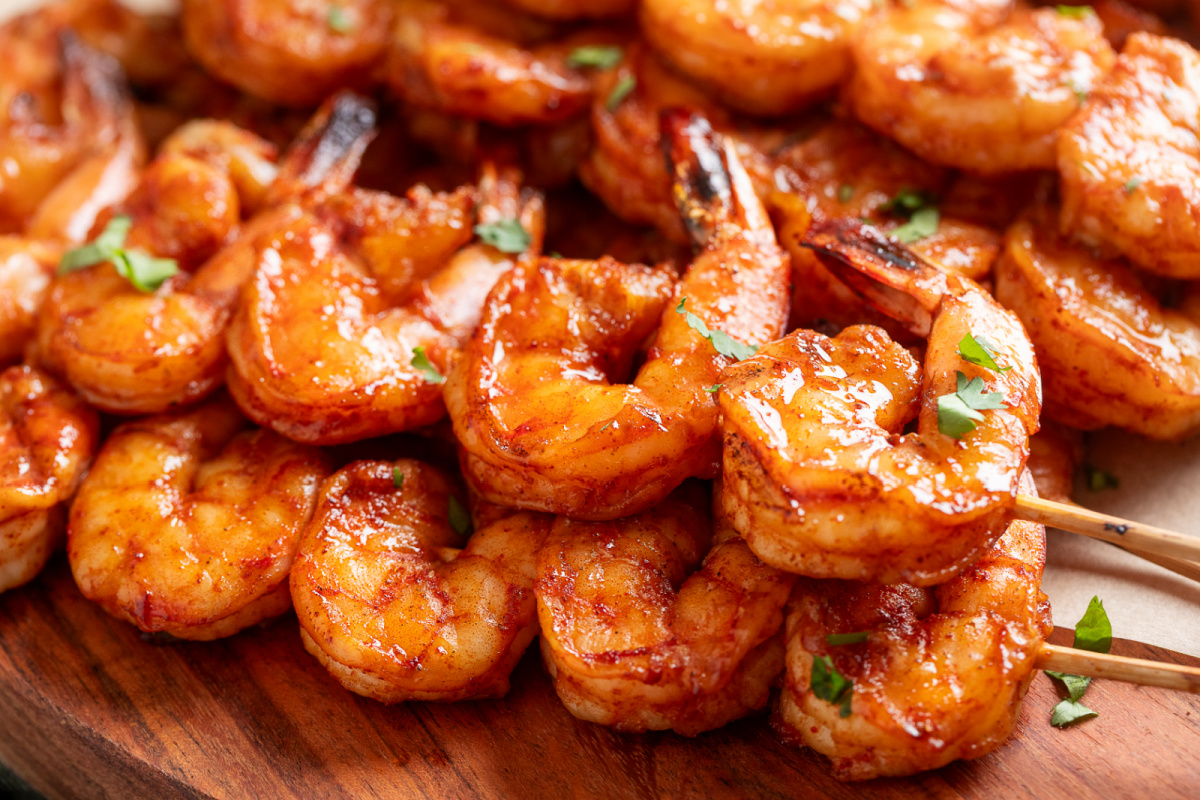Close-up of chipotle honey grilled shrimp skewers with lightly charred edges