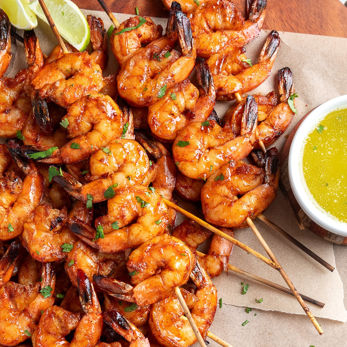 Close-up of grilled shrimp skewers coated in chipotle honey glaze
