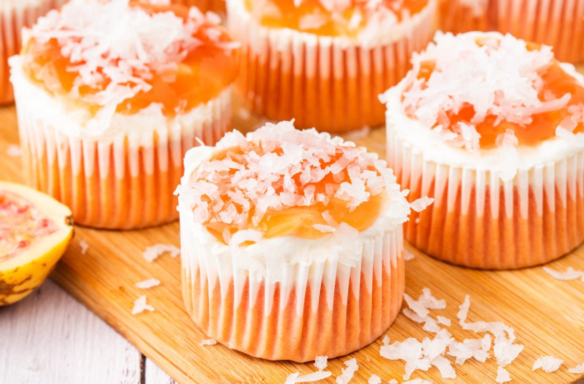 Guava cream cheese cupcakes topped with guava glaze and shredded coconut