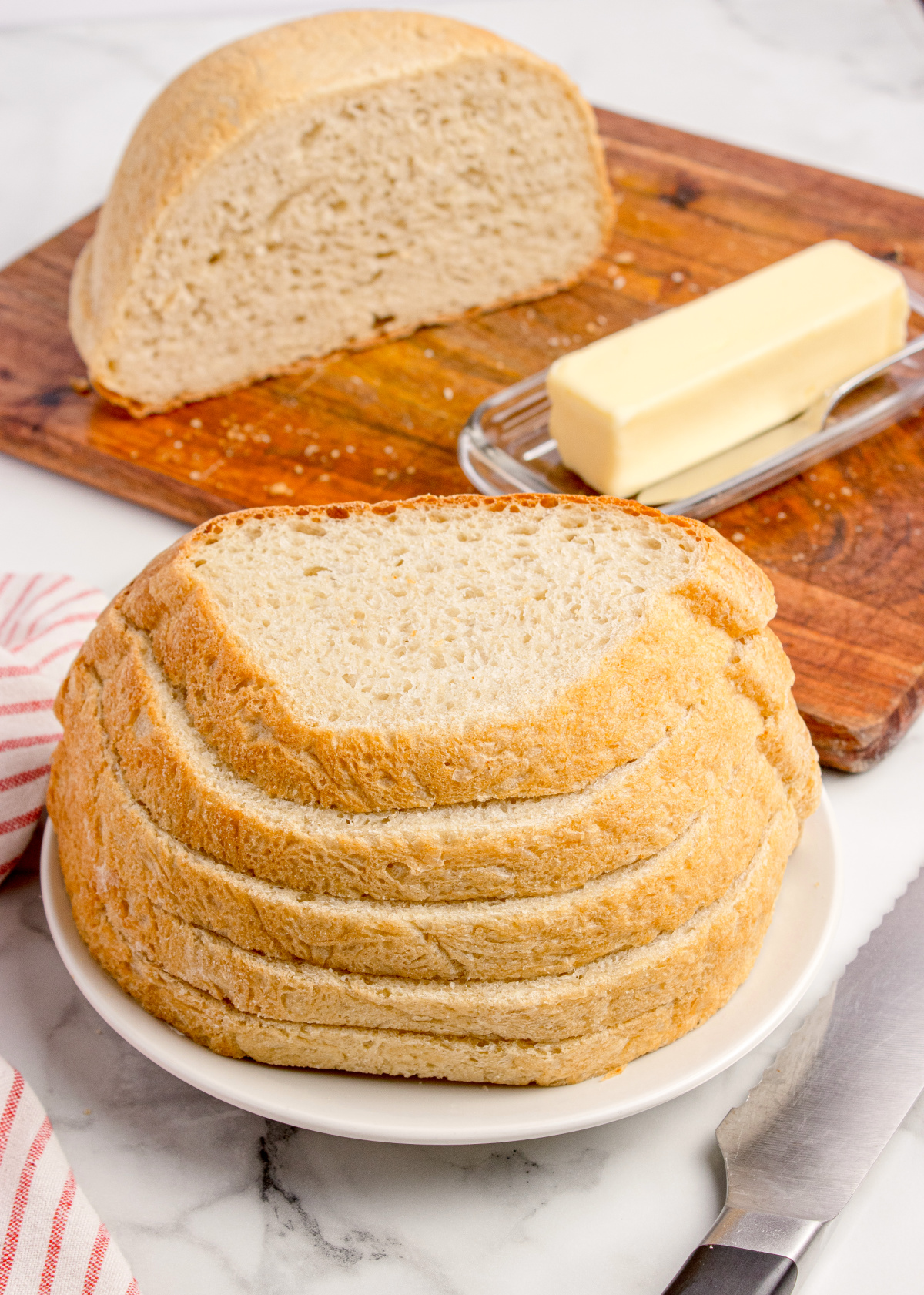 Homemade Peasant Bread Loaf Homemade peasant bread loaf sliced and served with butter