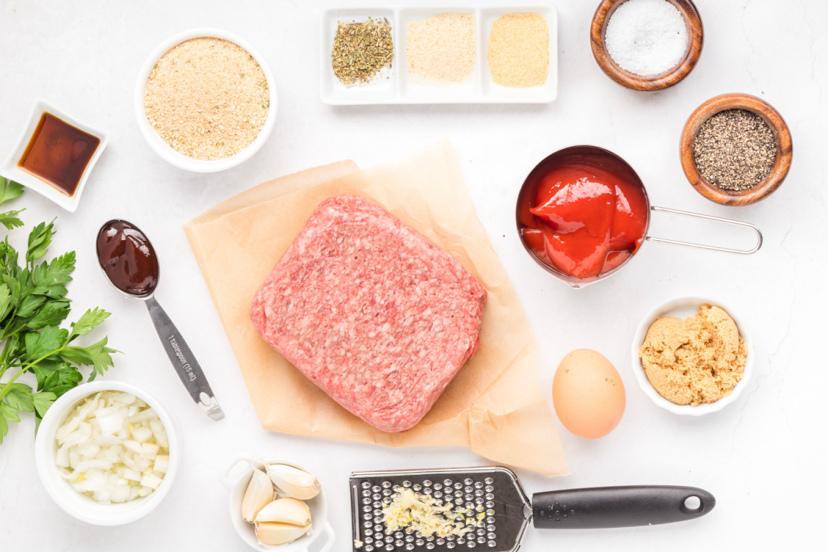 Mini meatloaf recipe ingredients measured and ready to prepare Ingredients for mini meatloaf recipe including ground beef, breadcrumbs, onion, ketchup, and seasonings