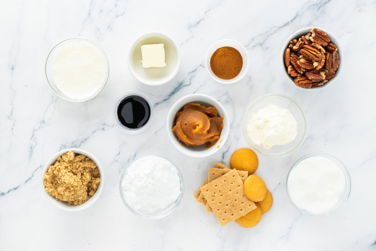 Pecan Cream Pie Ingredients Ingredients for pecan cream pie including pecans, cream cheese, heavy cream, graham crackers, vanilla wafers, brown sugar, powdered sugar, and vanilla