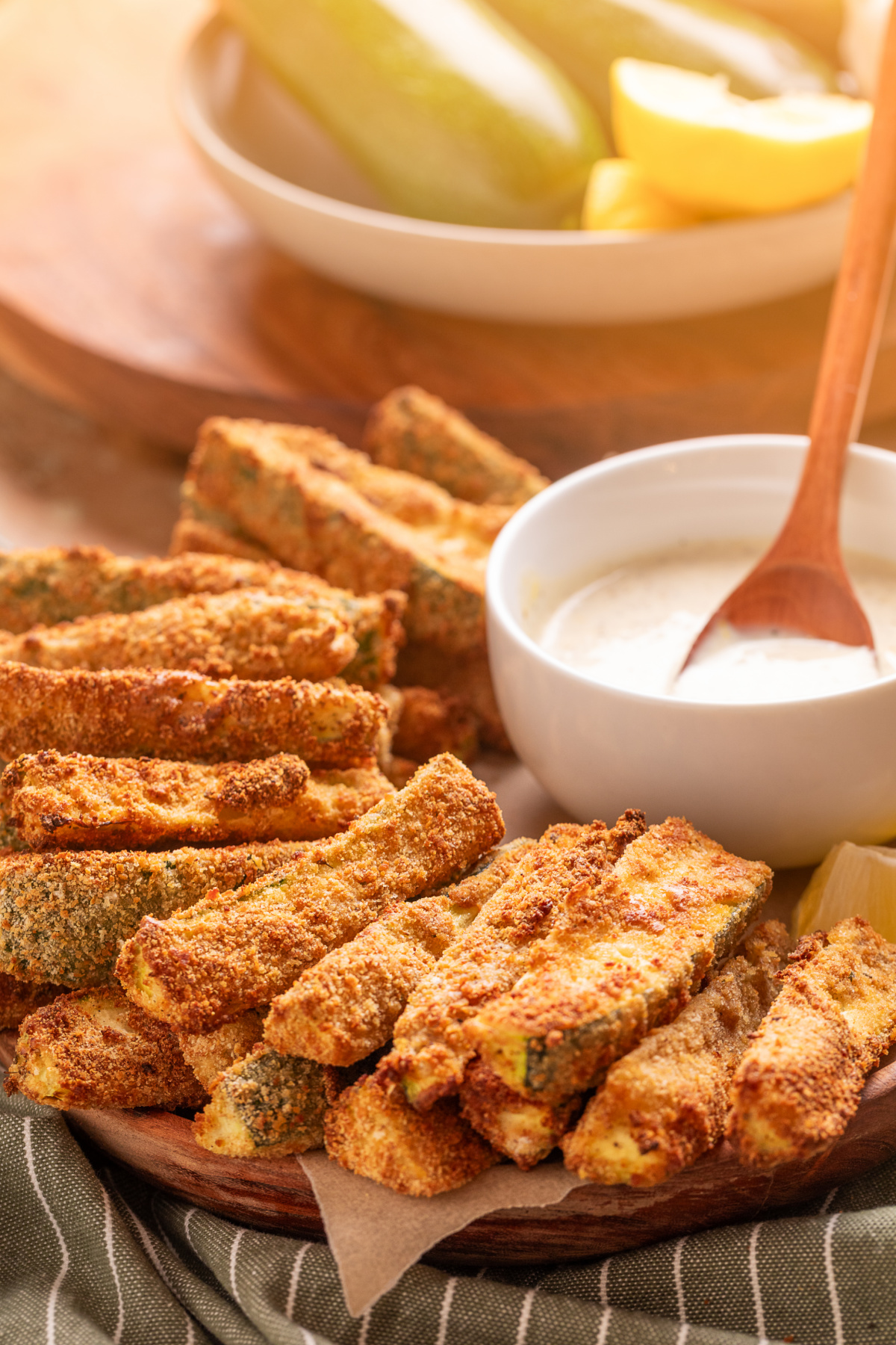 Air Fryer Zucchini Fries with Lemon Garlic Aioli Air fryer zucchini fries with a crispy breadcrumb coating served with homemade lemon garlic aioli.