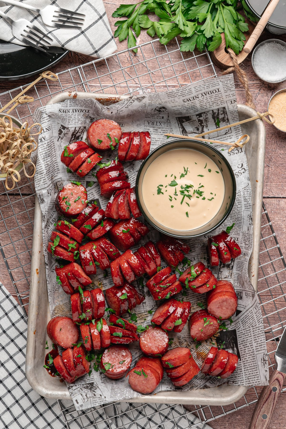 Honey garlic hasselback kielbasa bites with sticky honey garlic glaze and creamy honey mustard. Honey garlic hasselback kielbasa bites served beside creamy honey mustard dipping sauce.