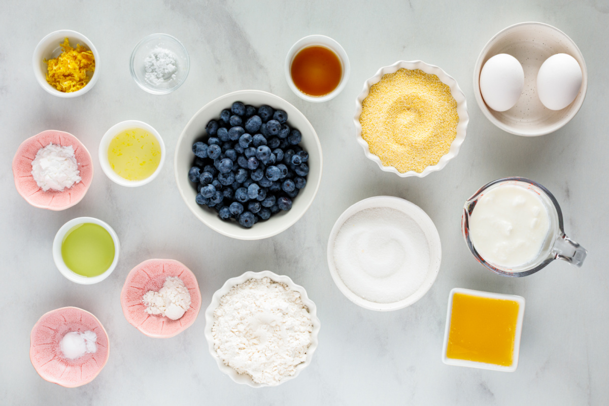 Everything you need to make lemon blueberry cornbread, from fresh blueberries and lemons to buttermilk and cornmeal. Ingredients for lemon blueberry cornbread including cornmeal, flour, buttermilk, fresh blueberries, lemons, eggs, butter, and lemon zest.