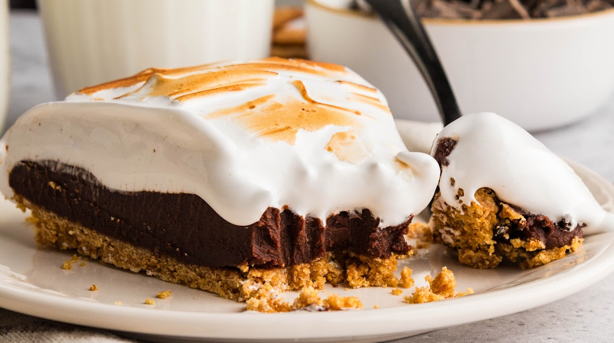 S'mores pie with chocolate ganache, homemade toasted marshmallow topping, and a graham cracker crust.