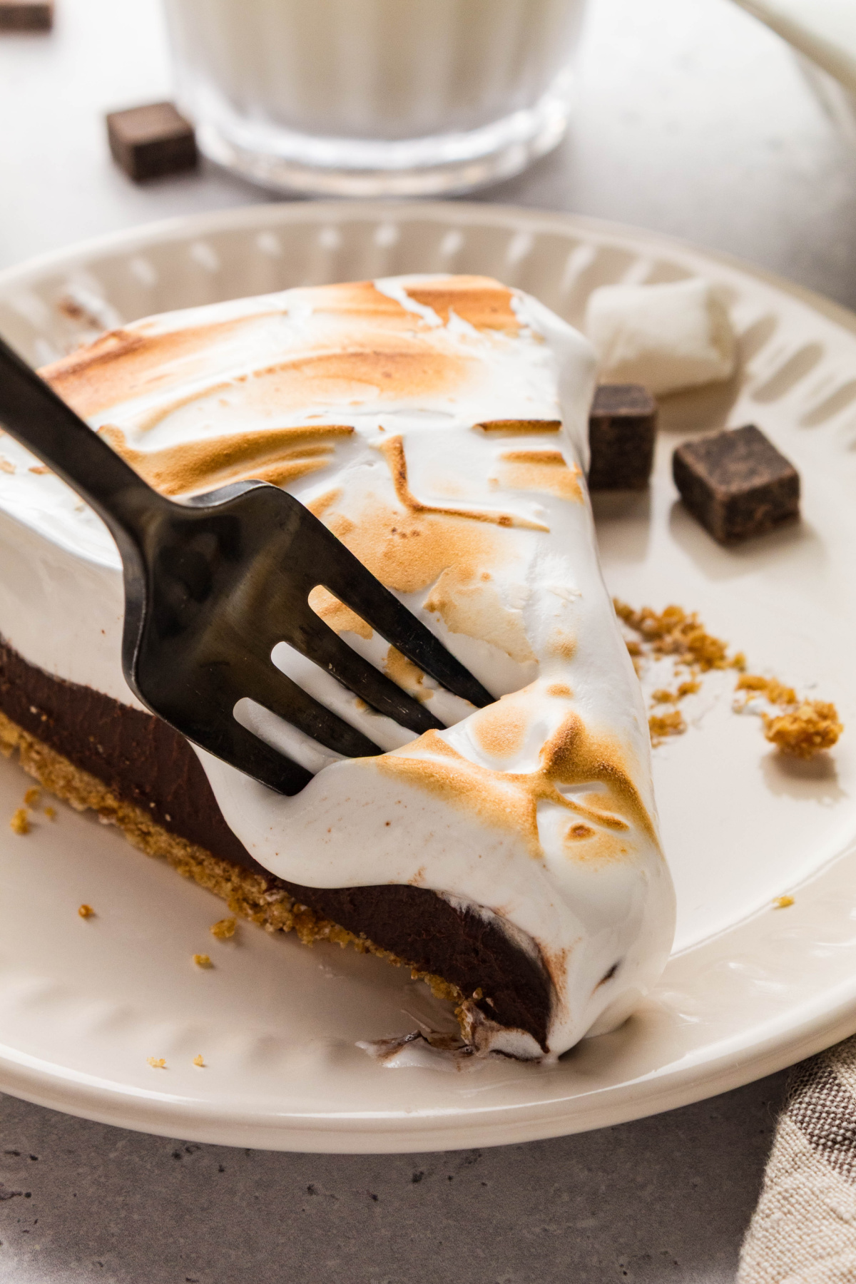 S'mores pie with chocolate ganache, homemade toasted marshmallow topping, and a graham cracker crust.