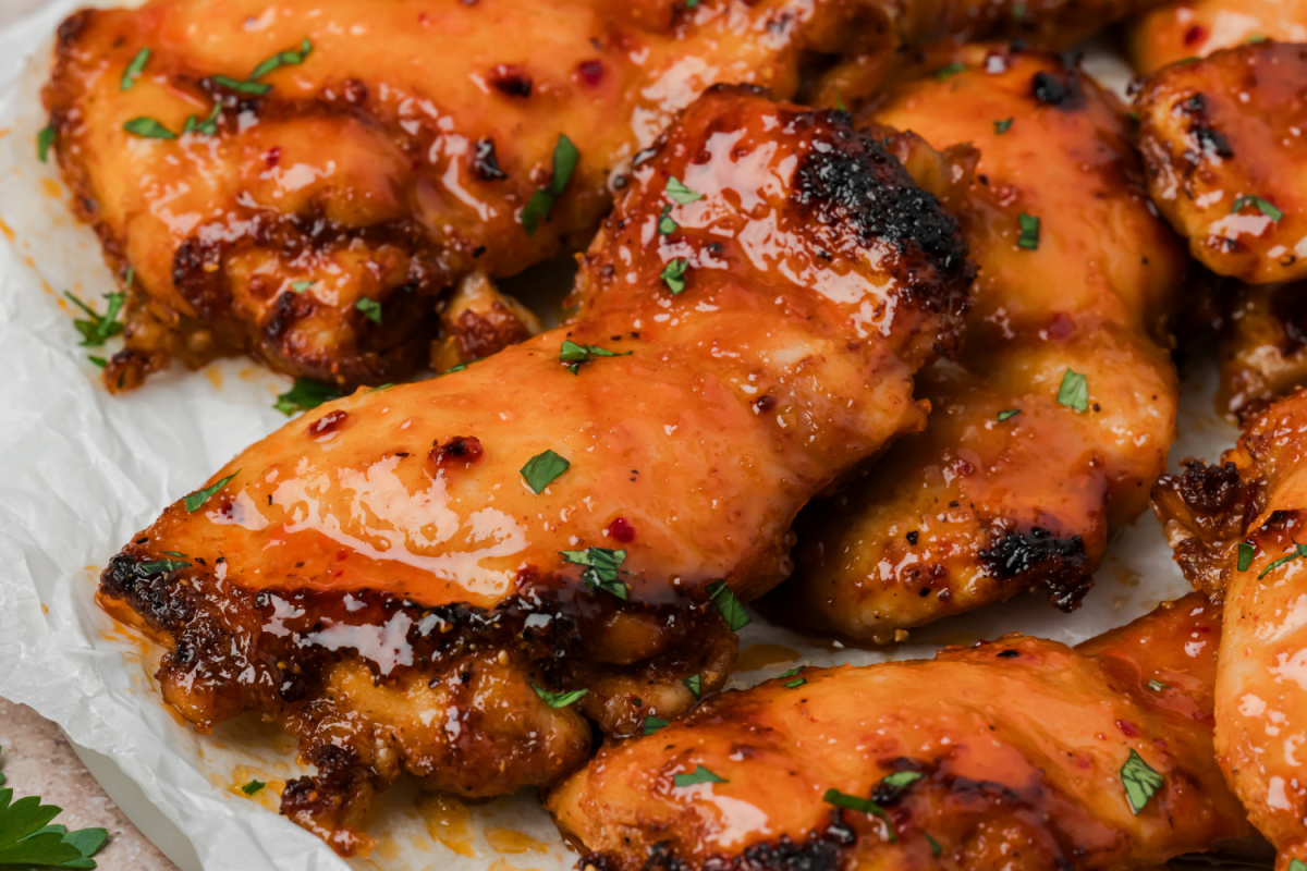 Close-up of hot honey chicken thighs with caramelized homemade hot honey glaze.