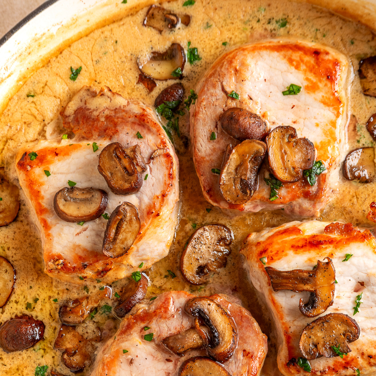 Creamy mushroom pork chops with roasted mushrooms and fresh sage cream sauce