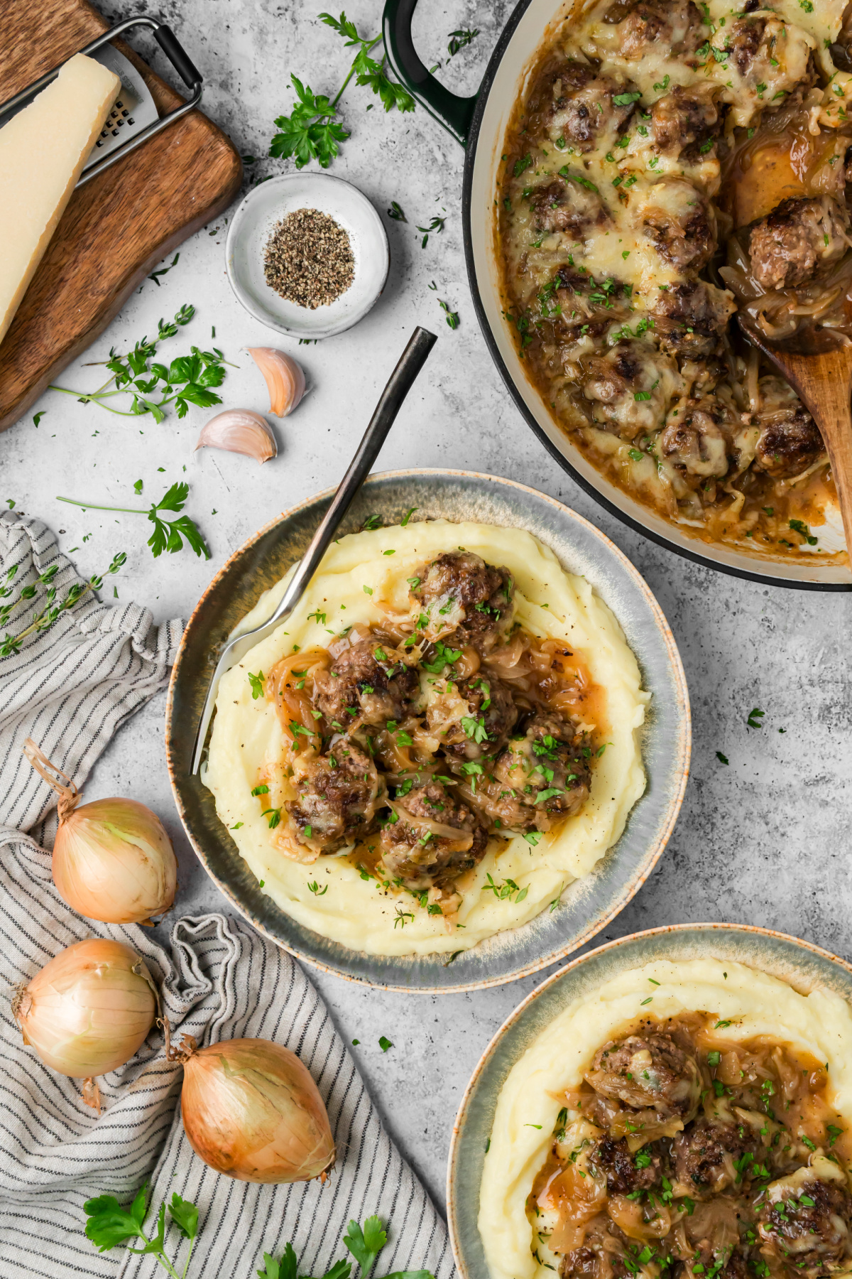 French onion meatballs served over creamy mashed potatoes with caramelized onion sauce. French onion meatballs with caramelized onions and Gruyère served over mashed potatoes