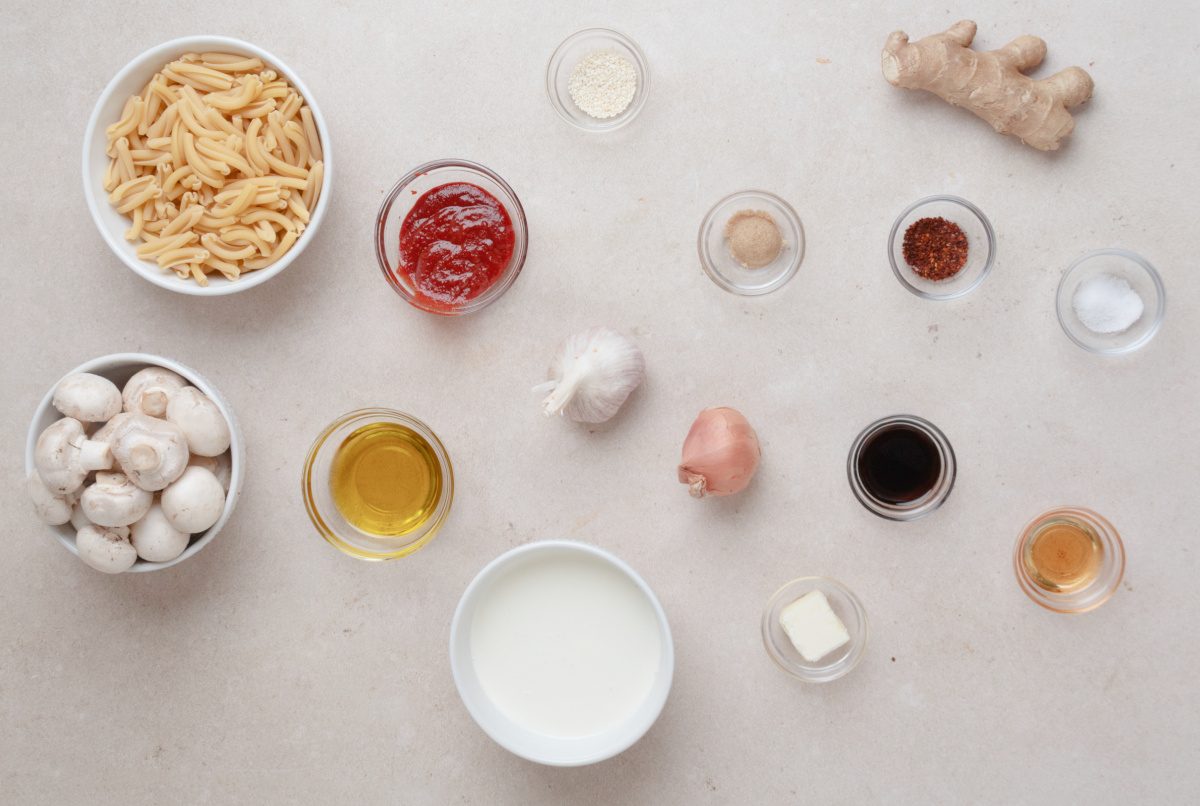 Casarecce, mushrooms, gochujang, heavy cream and aromatics for creamy gochujang pasta Ingredients for gochujang pasta including casarecce, mushrooms, gochujang, cream, garlic, ginger and gochugaru