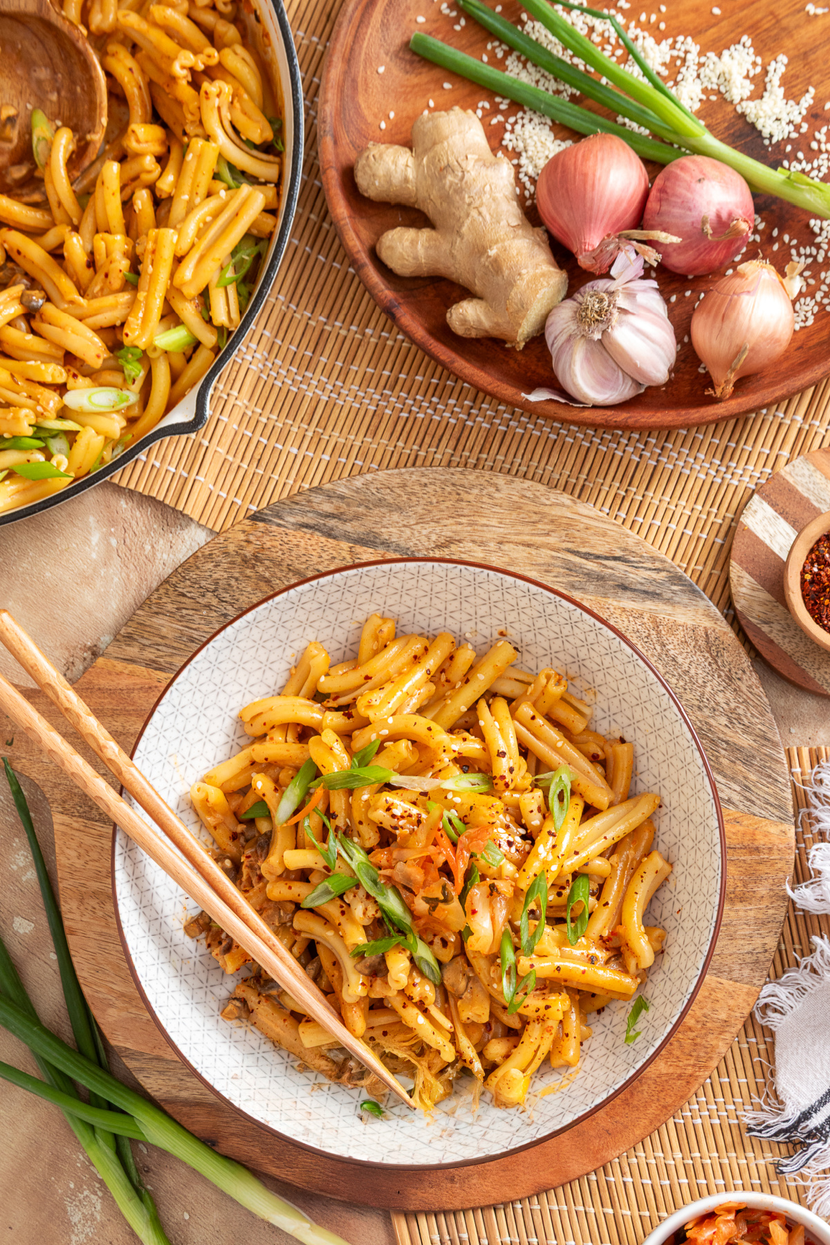 Creamy mushroom pasta with gochujang, kimchi and fresh green onions Bowl of gochujang pasta with mushrooms, kimchi, sliced green onions and gochugaru