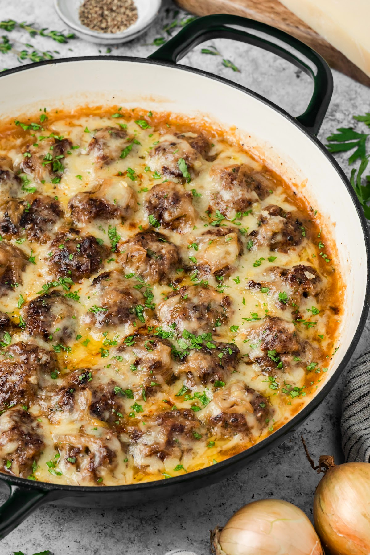Browned beef meatballs covered with caramelized onions, melted Gruyère and fresh parsley. Beef meatballs with caramelized onions and melted Gruyère in a French onion sauce