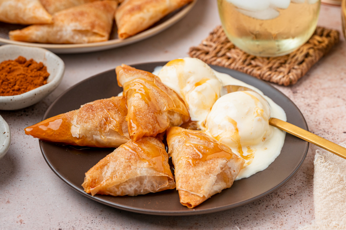 Apple Pie Samosas with Ice Cream and Caramel Apple pie samosas served warm with vanilla ice cream and caramel sauce.