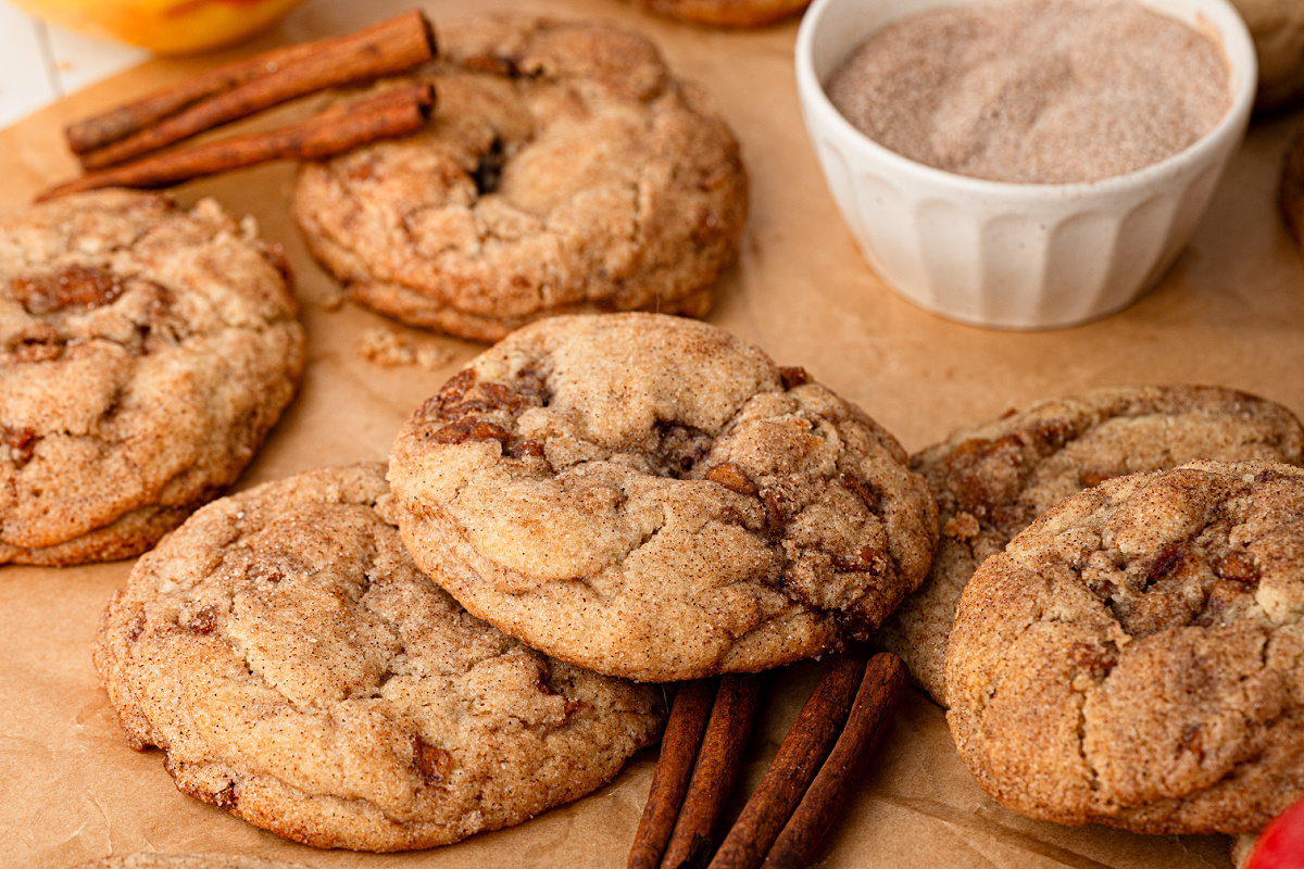 Thick apple snickerdoodles with pieces of cinnamon-spiced apple throughout
