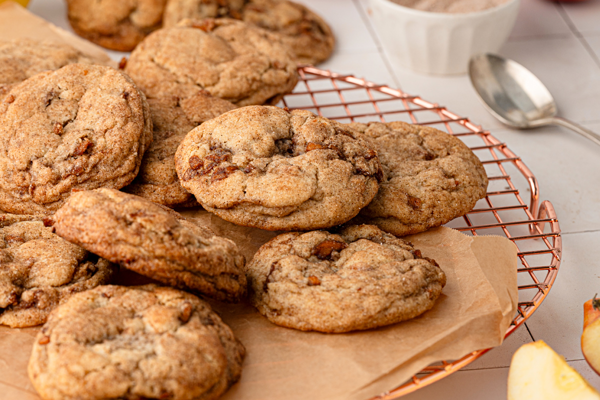 Soft and chewy apple snickerdoodles cooling on a wire rack