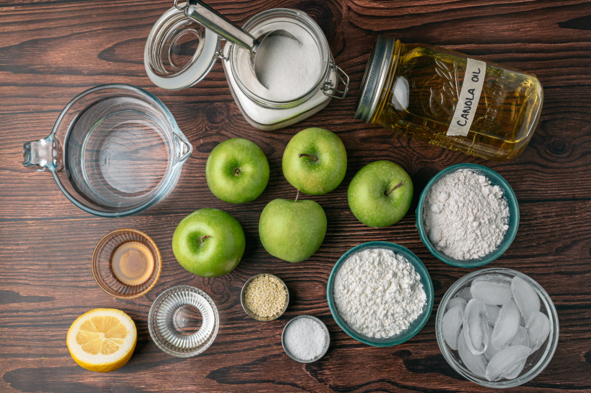 Ingredients for Chinese Toffee Apples Ingredients for Chinese toffee apples including Granny Smith apples, flour, cornstarch, sugar, sesame seeds and canola oil