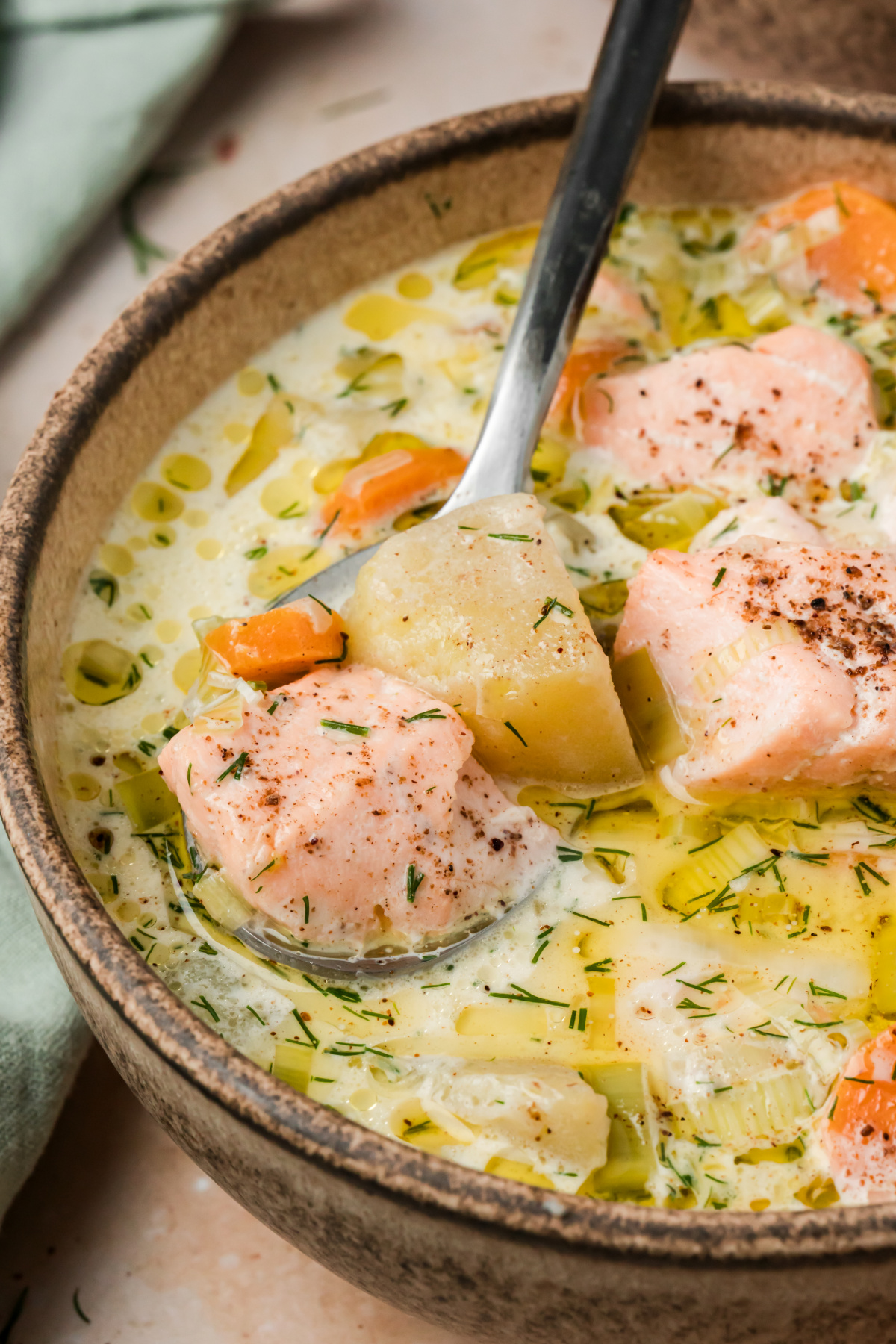 Finnish salmon soup with salmon chunks, Yukon Gold potatoes, carrots, leeks and fresh dill in a creamy broth.