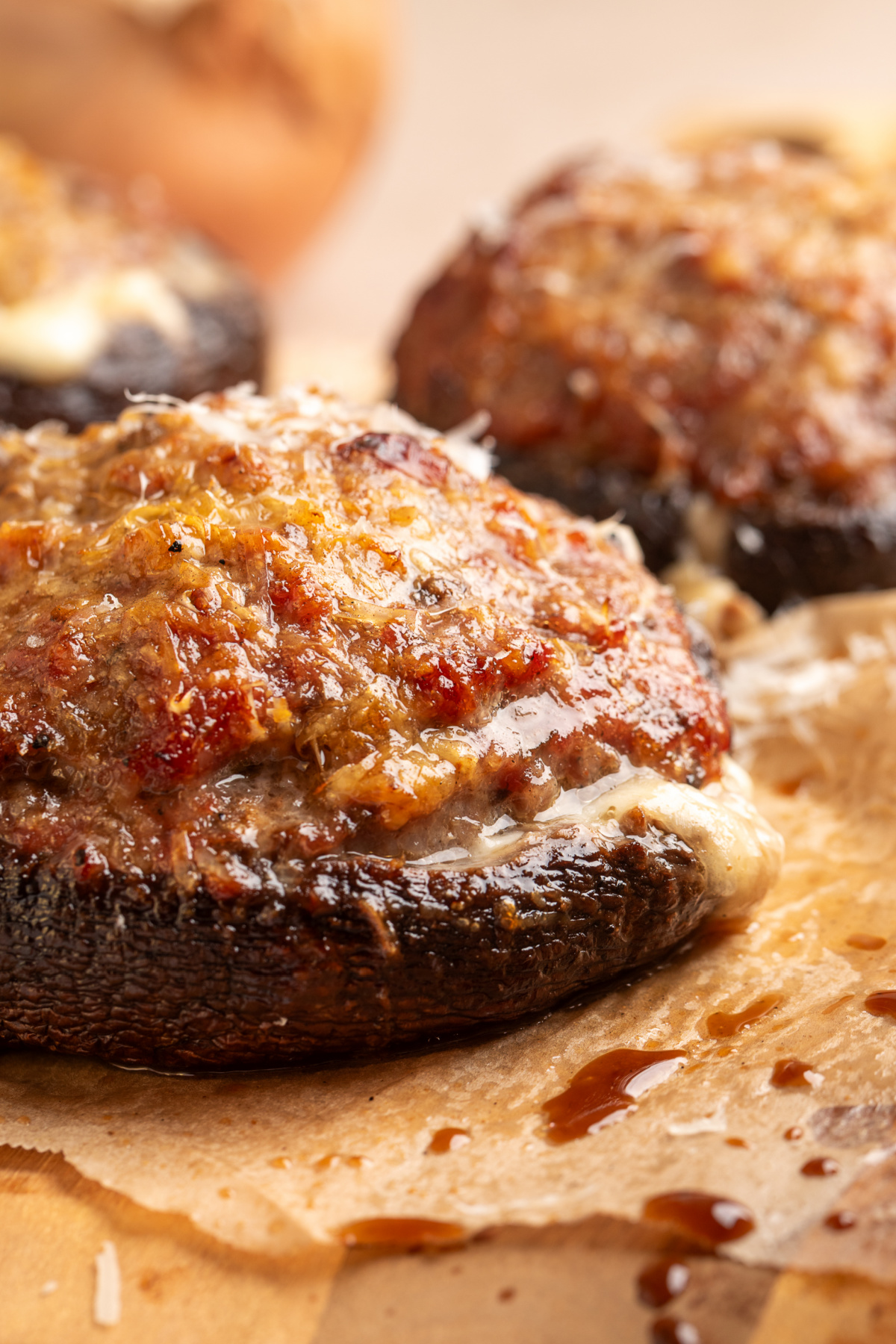 Sweet Italian sausage stuffed into grilled portobello mushrooms with Parmesan on top and melted mozzarella underneath. Grilled sausage stuffed portobello mushrooms with browned Parmesan and melted mozzarella
